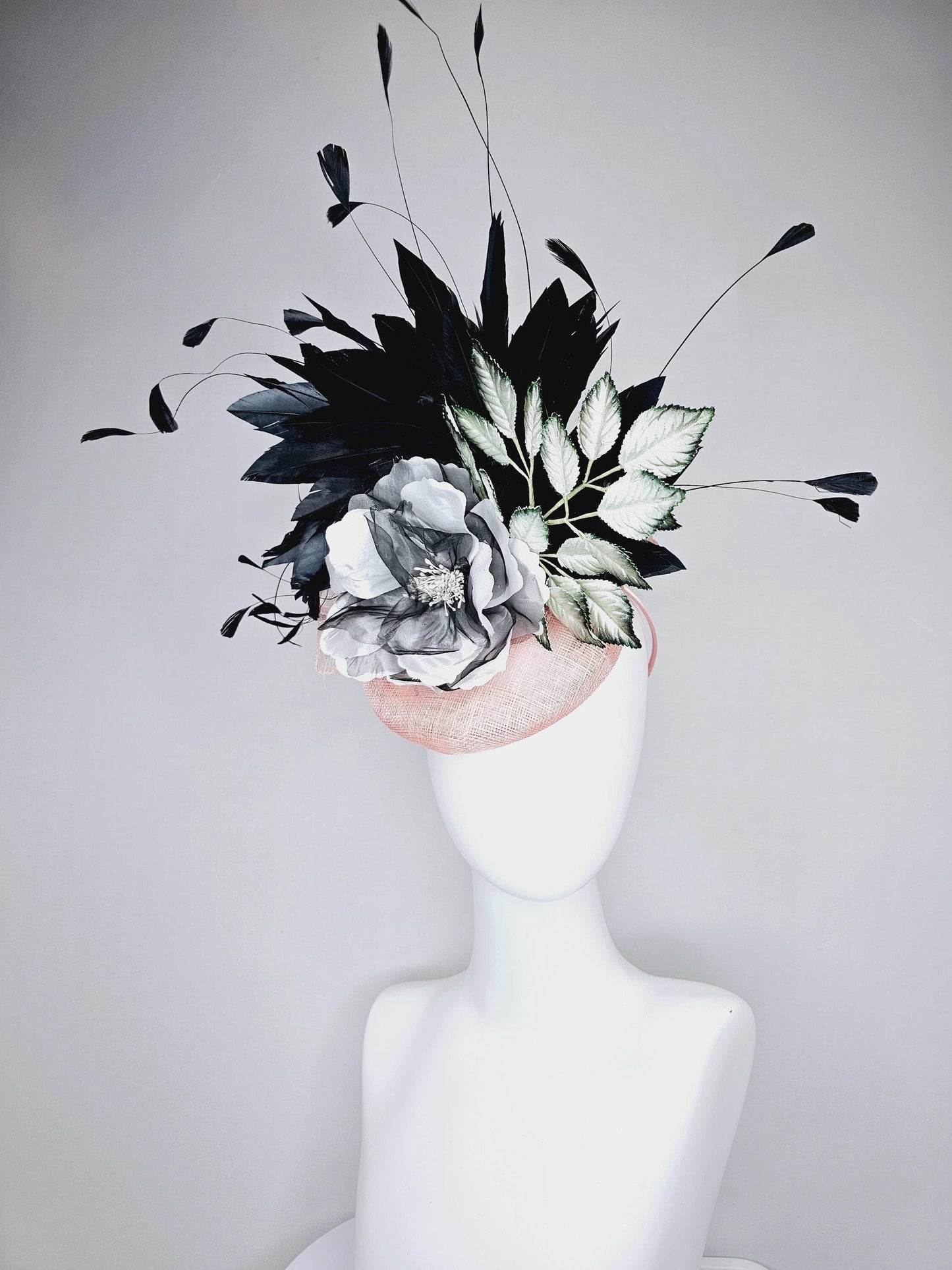 kentucky derby hat fascinator light pink sinamay with black and white organza flower, ombre black green leaves, black branching feathers