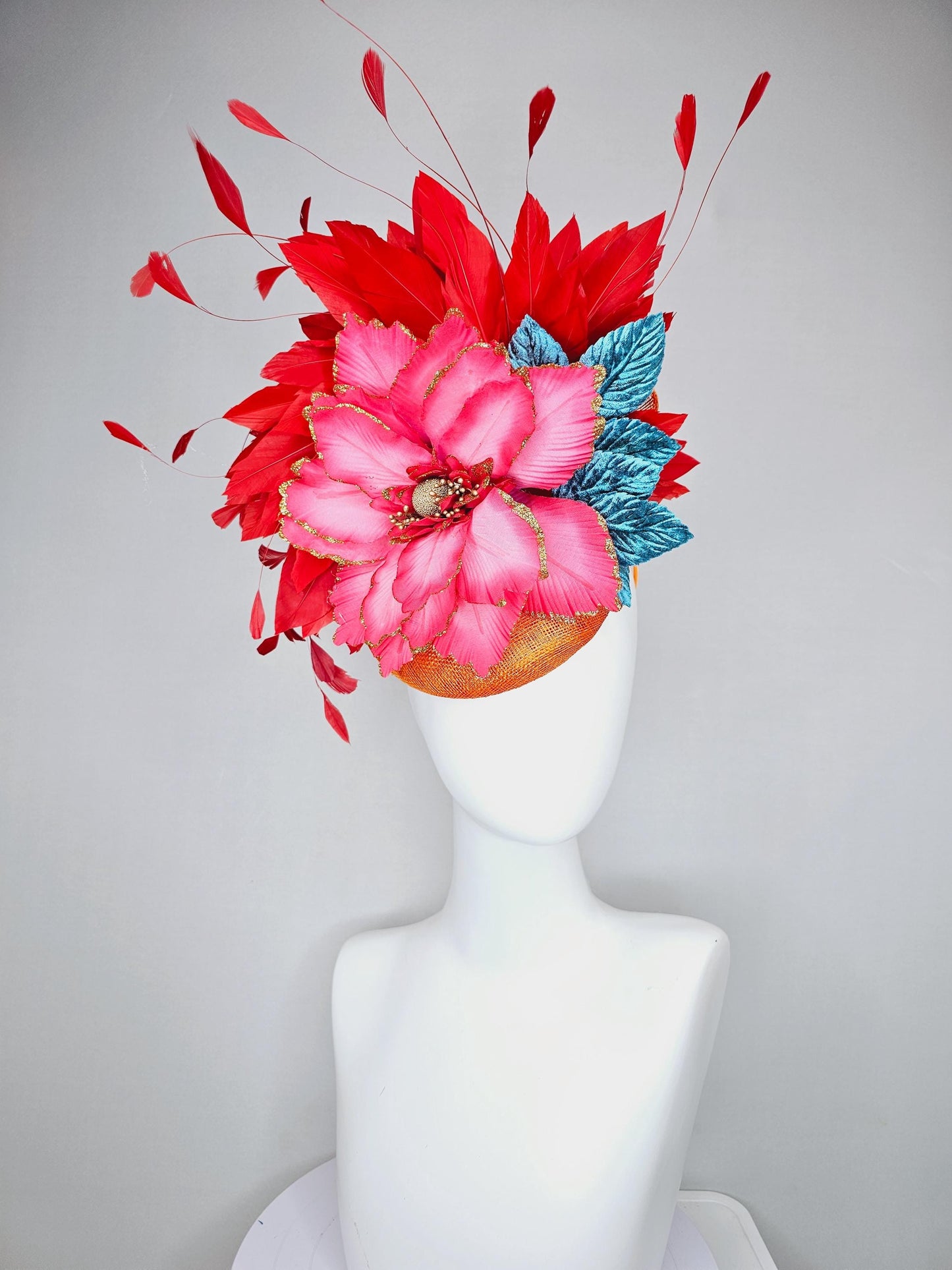 kentucky derby hat fascinator burnt orange sinamay with scarlet red branching feathers, large ombre cherry red satin flower,teal blue leaves