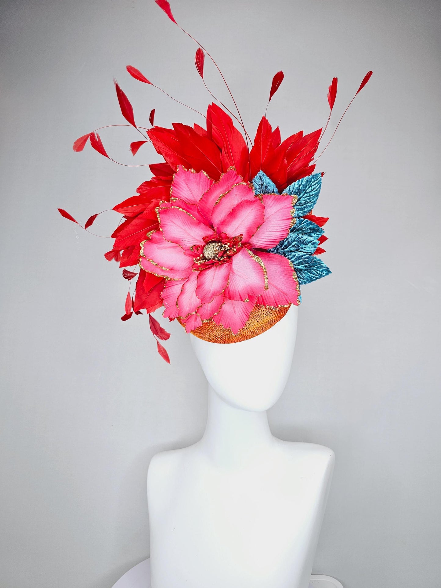 kentucky derby hat fascinator burnt orange sinamay with scarlet red branching feathers, large ombre cherry red satin flower,teal blue leaves