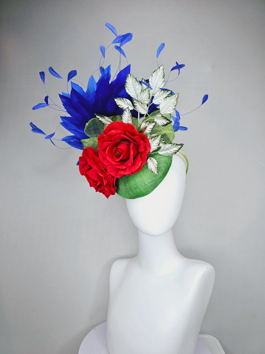 kentucky derby hat fascinator green sinamay with royal blue branching feathers,light green ombre leaves and bright red satin silk roses