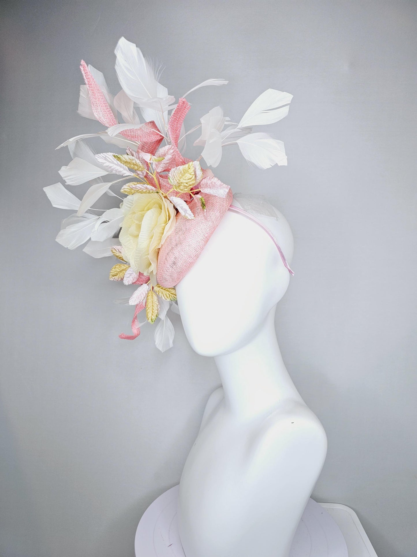 kentucky derby hat fascinator light pink sinamay with curls,white branching feathers,light pastel yellow satin silk rose,yellow pink leaves