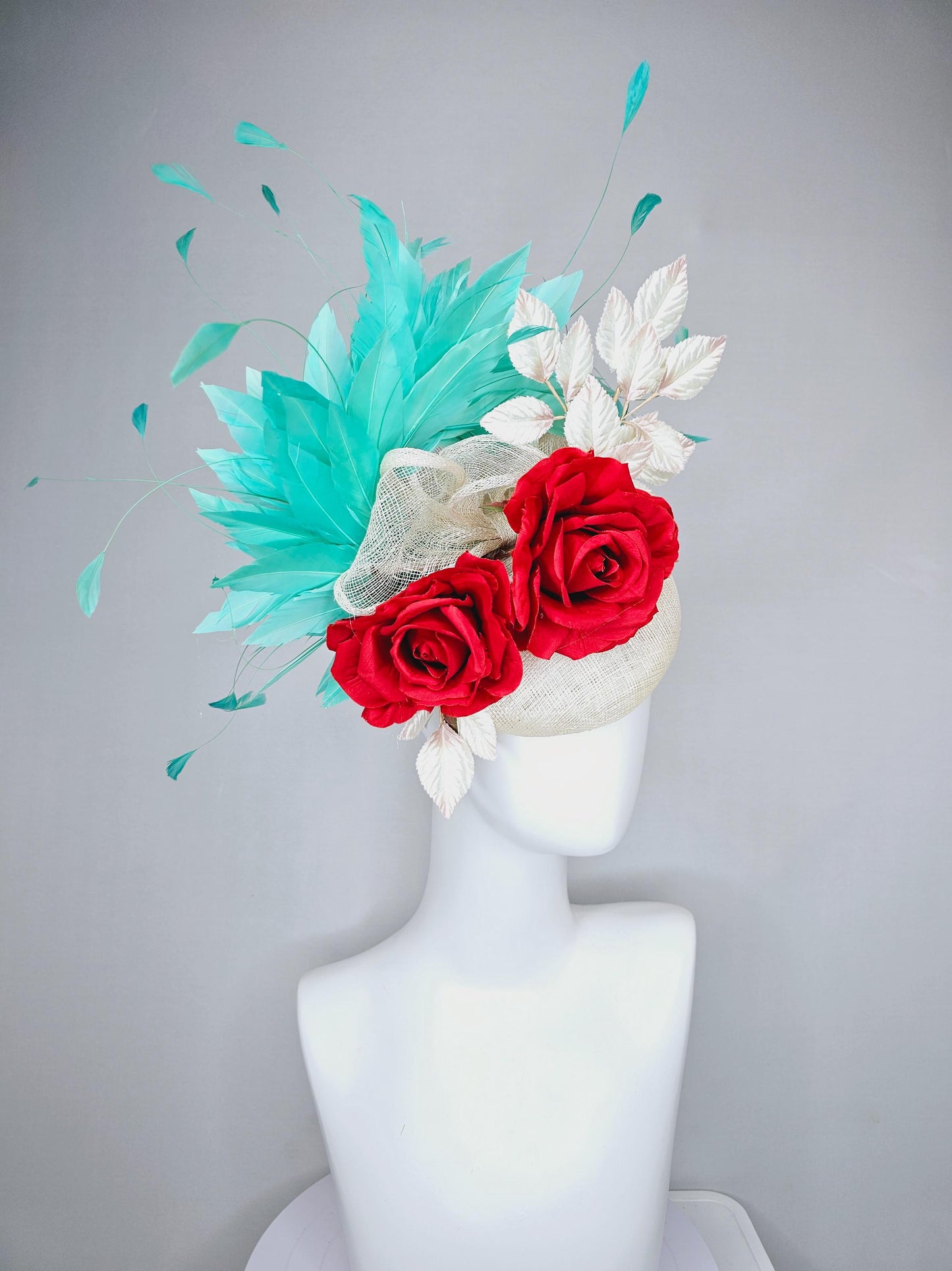 kentucky derby hat fascinator white ivory sinamay with white velvet leaves,aqua green blue branching feathers,bright red satin silk roses