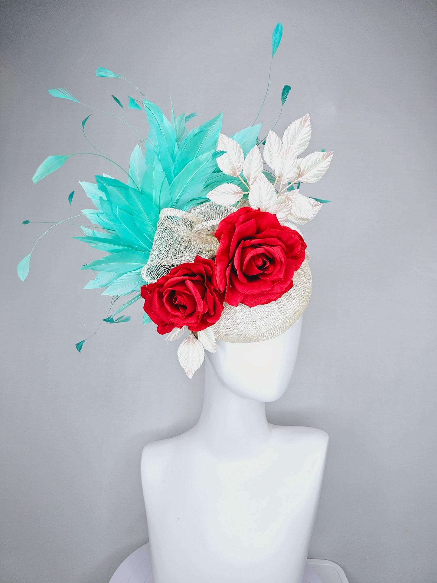 kentucky derby hat fascinator white ivory sinamay with white velvet leaves,aqua green blue branching feathers,bright red satin silk roses