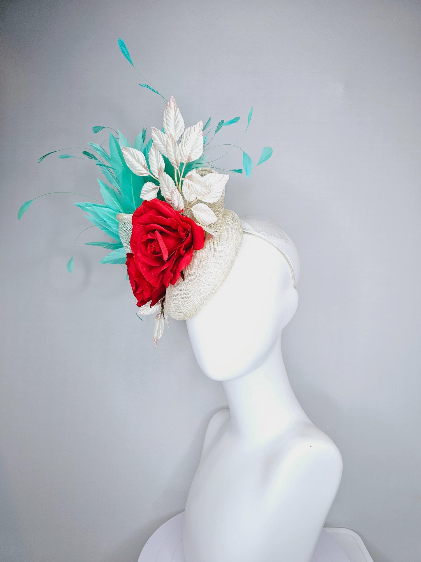 kentucky derby hat fascinator white ivory sinamay with white velvet leaves,aqua green blue branching feathers,bright red satin silk roses