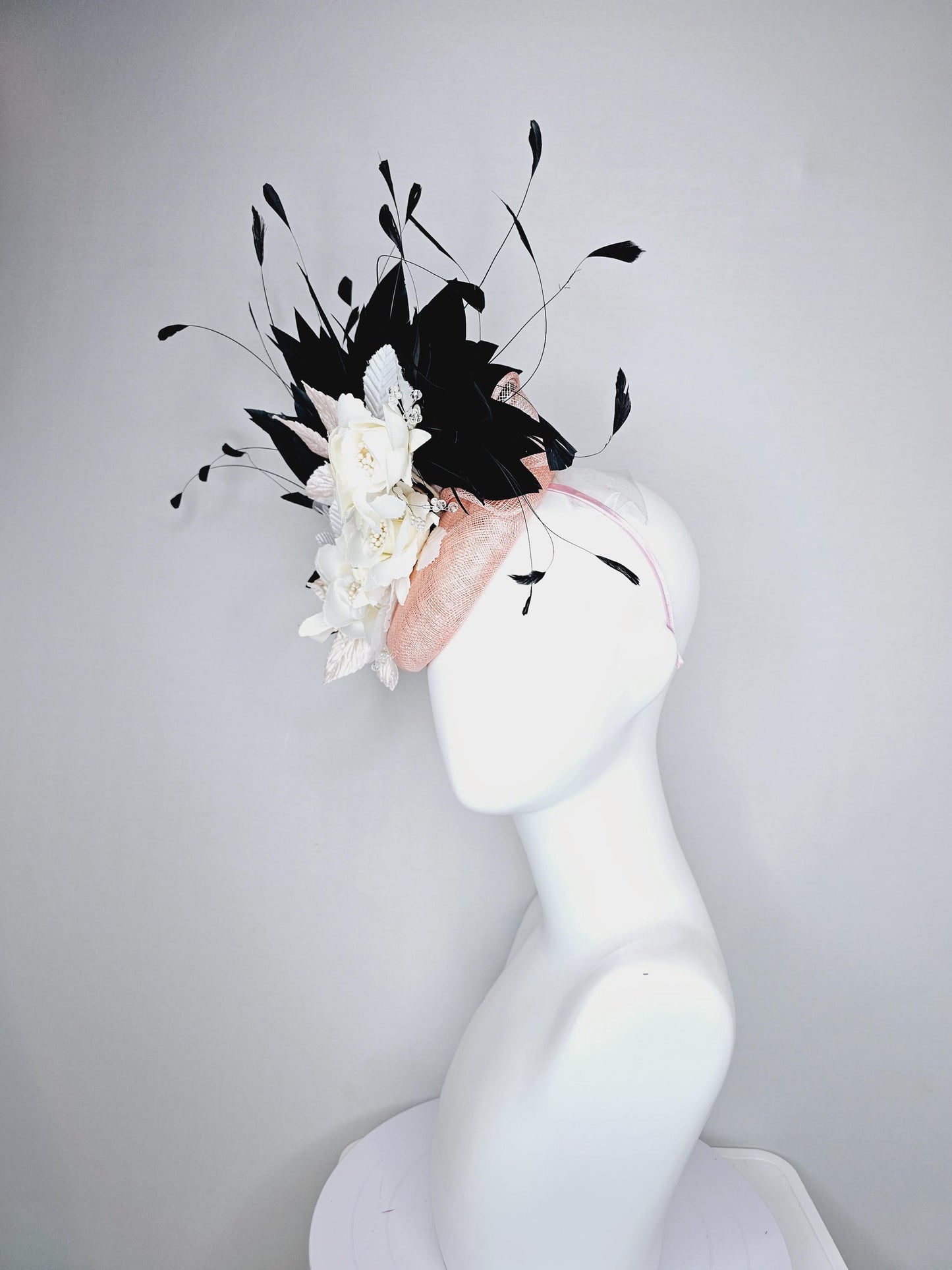 kentucky derby hat fascinator light pink sinamay with ivory white satin silk flowers, light pink white leaves, black branching feathers