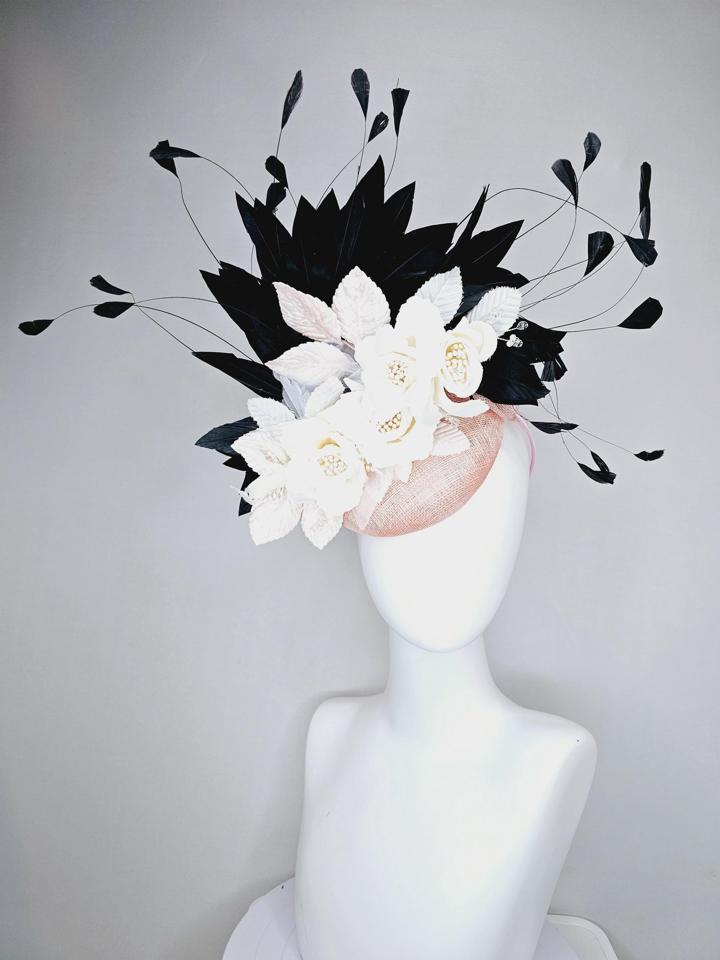 kentucky derby hat fascinator light pink sinamay with ivory white satin silk flowers, light pink white leaves, black branching feathers