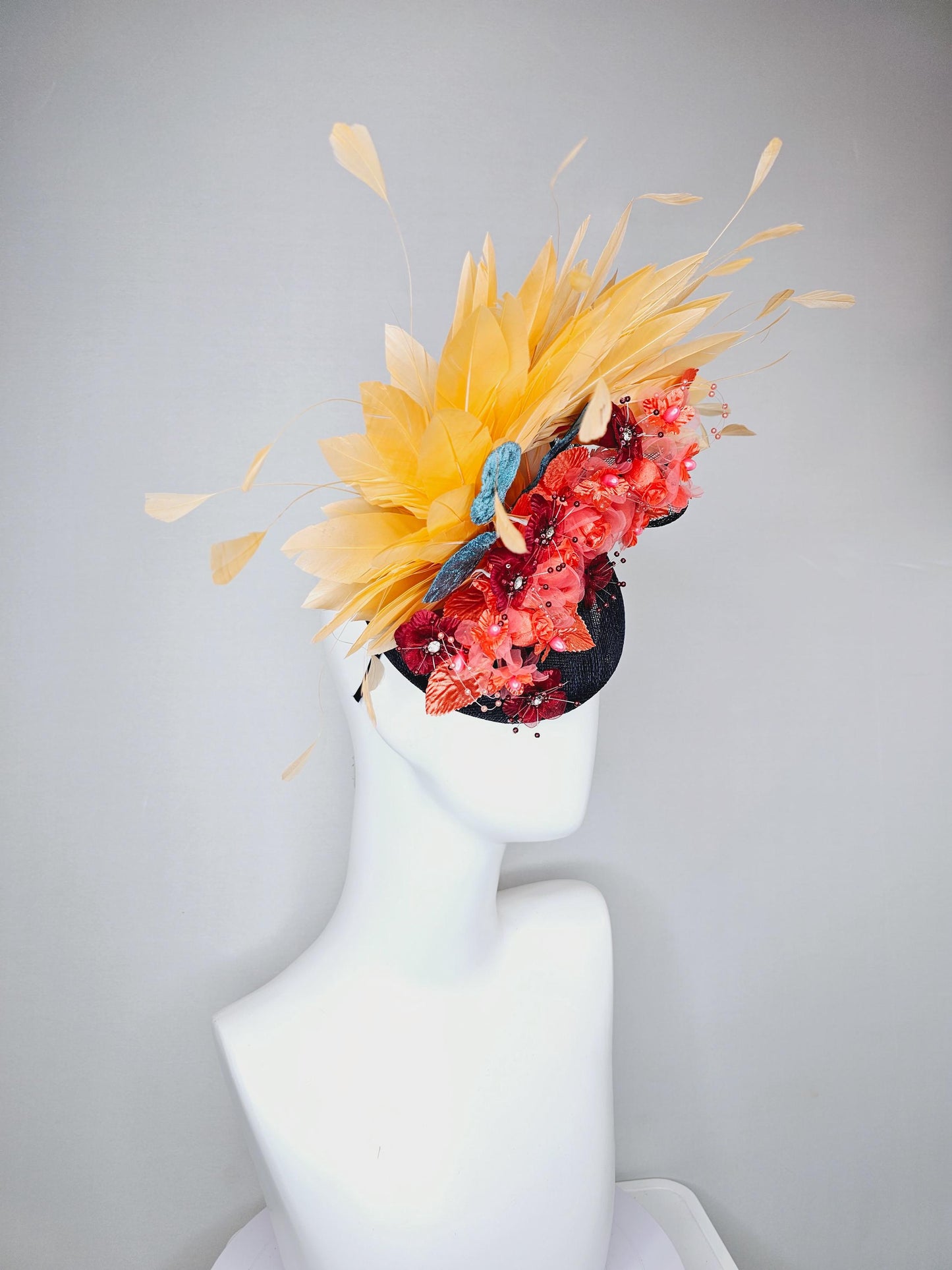 kentucky derby hat fascinator black sinamay, apricot orange yellow feathers, coral orange wine red satin flowers, sky blue coral leaves