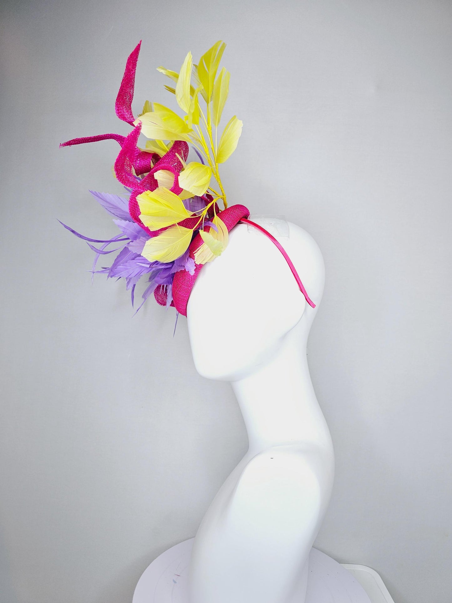 kentucky derby hat fascinator hot pink sinamay with curls and bright yellow branching feathers and purple feather flower