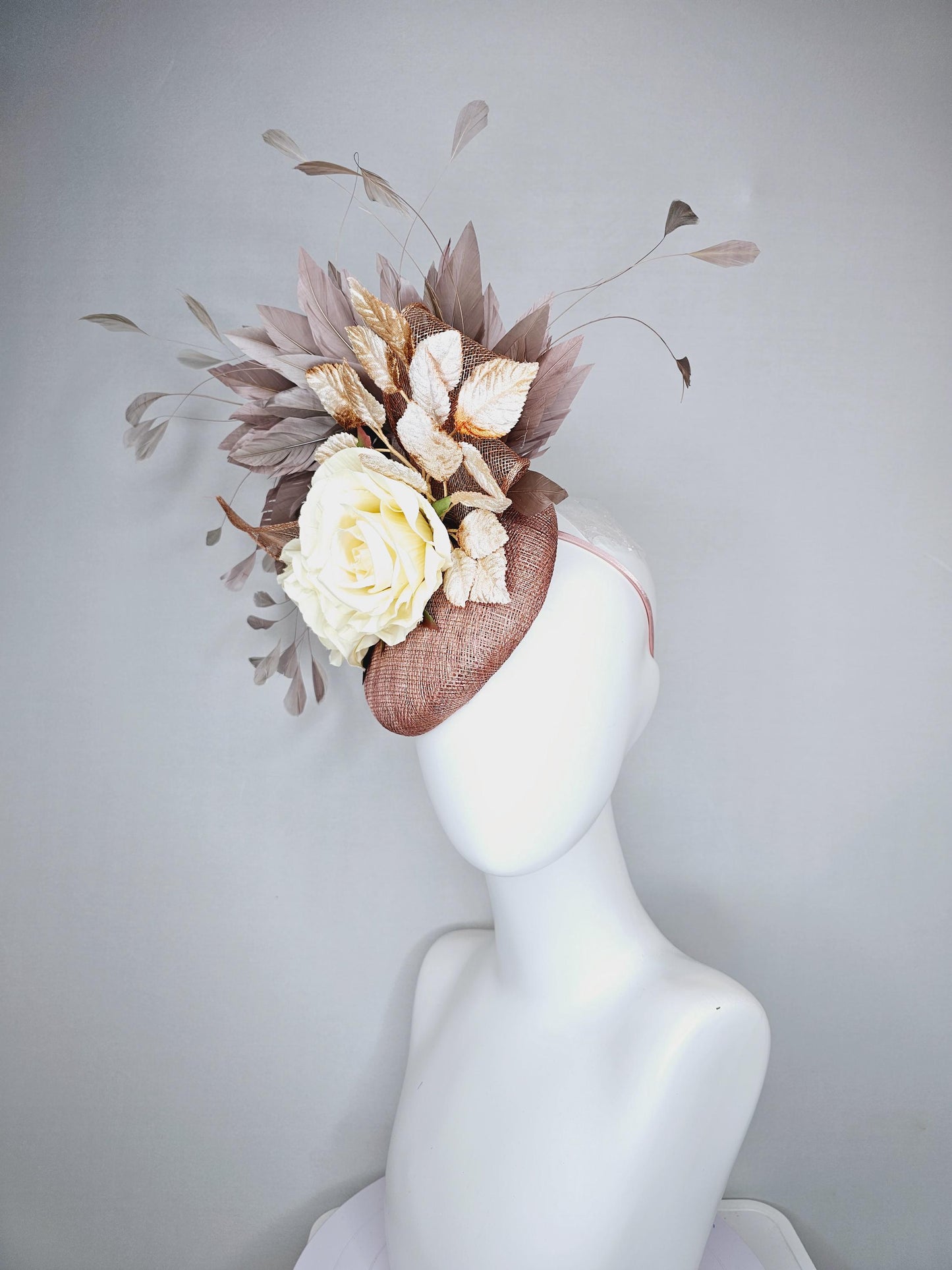 kentucky derby hat fascinator dusty pink sinamay,neutral taupe brown gray branching feathers,gold tan cream leaves,cream satin silk roses