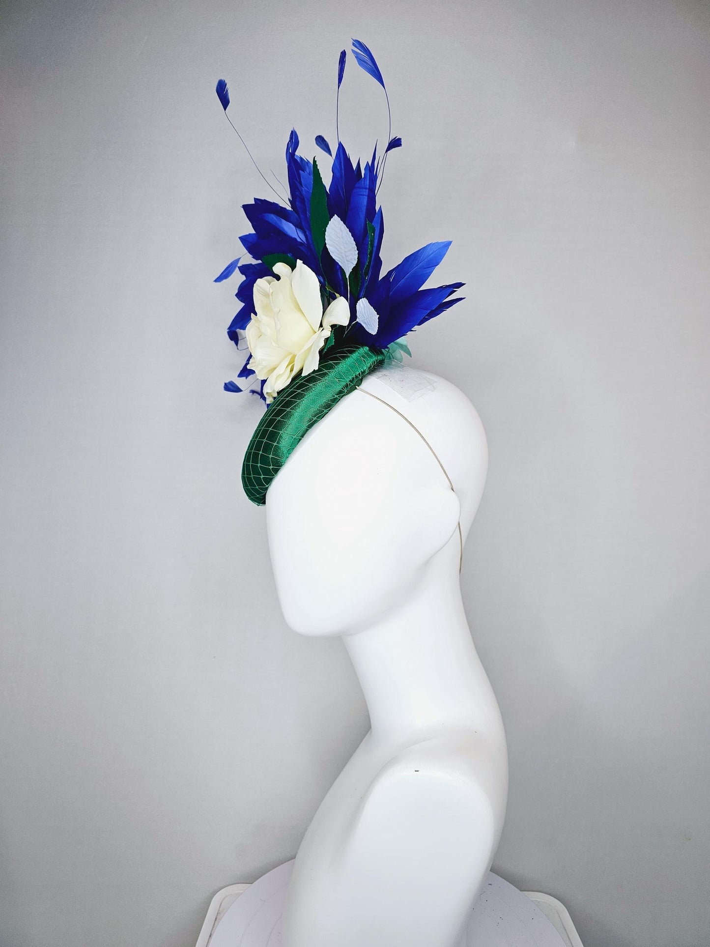 kentucky derby hat fascinator green satin with netting,white ivory satin rose flower,green leaves,royal cobalt blue branching feathers