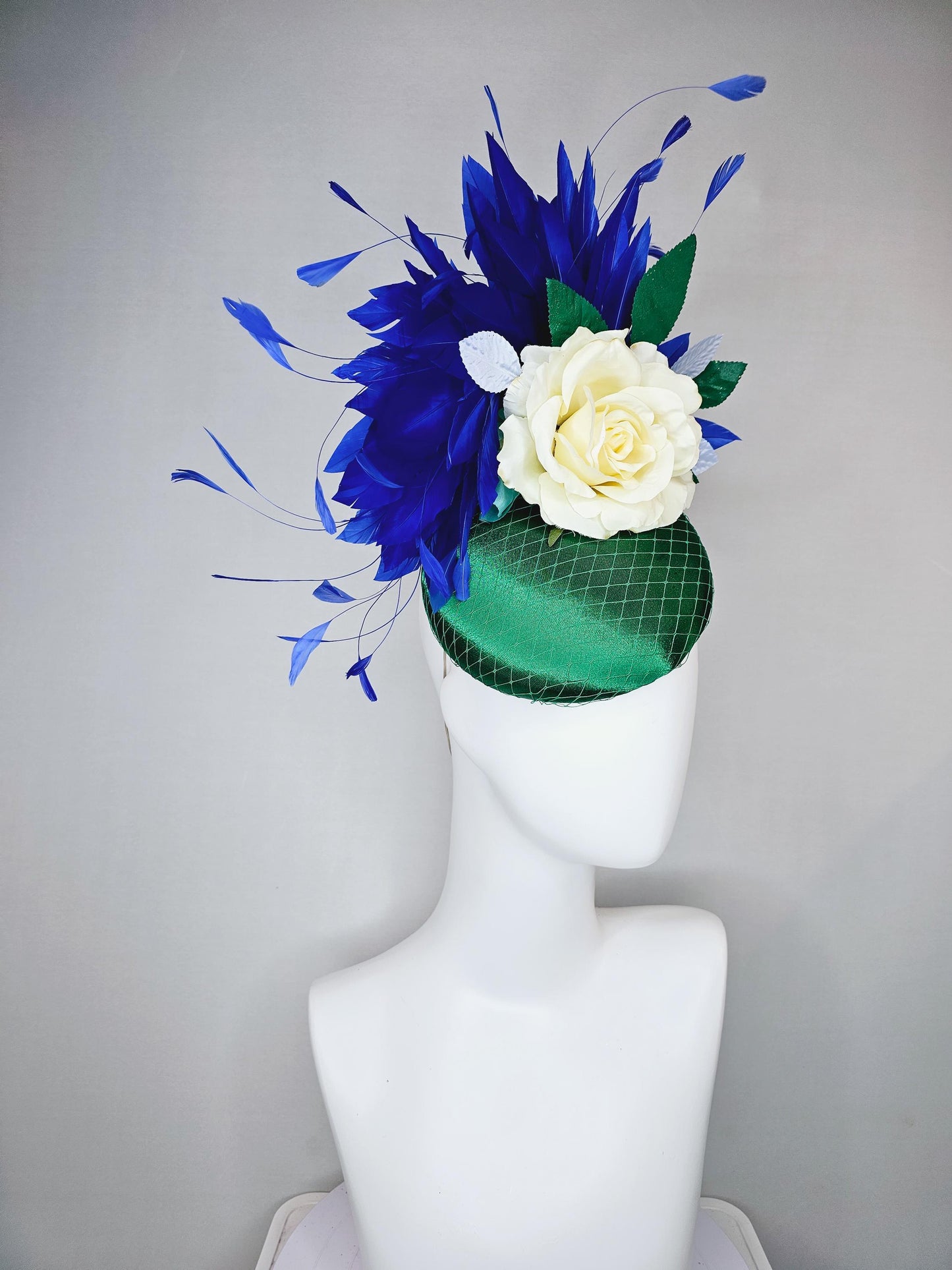 kentucky derby hat fascinator green satin with netting,white ivory satin rose flower,green leaves,royal cobalt blue branching feathers