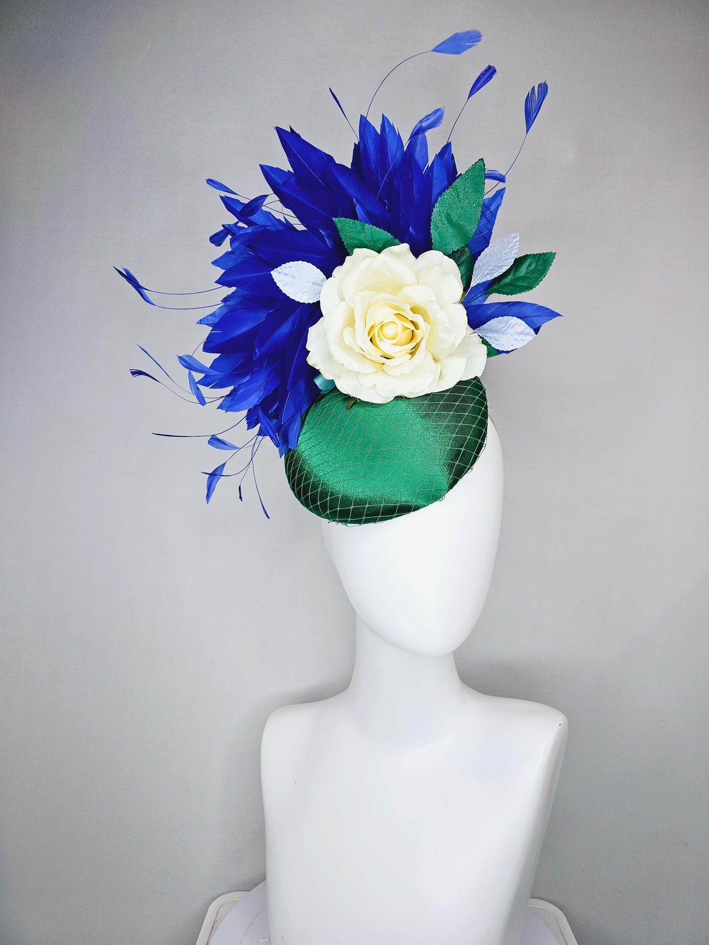 kentucky derby hat fascinator green satin with netting,white ivory satin rose flower,green leaves,royal cobalt blue branching feathers