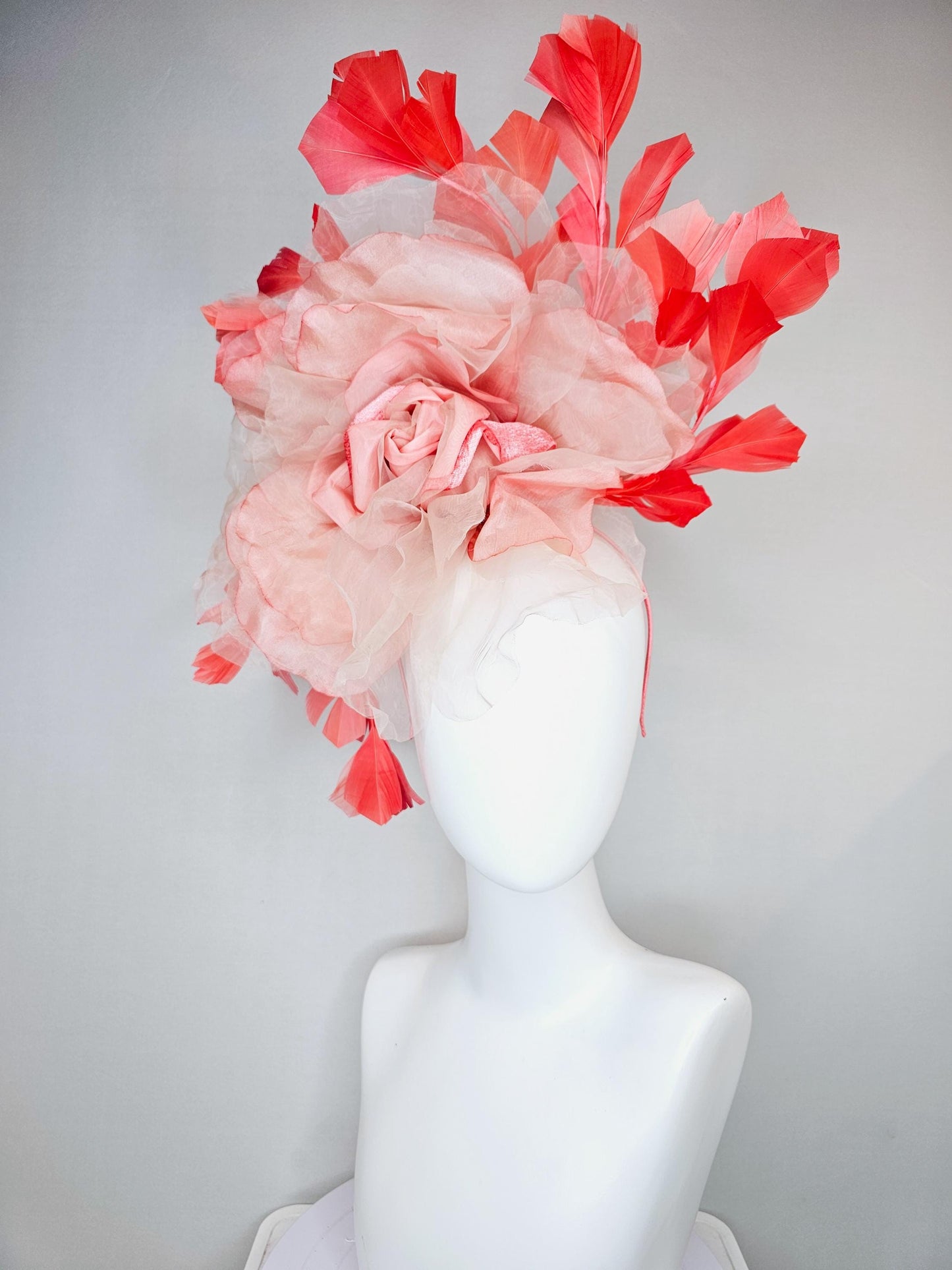 kentucky derby hat fascinator with large ombre peach pink organza flower and coral orange feathers, thin headband