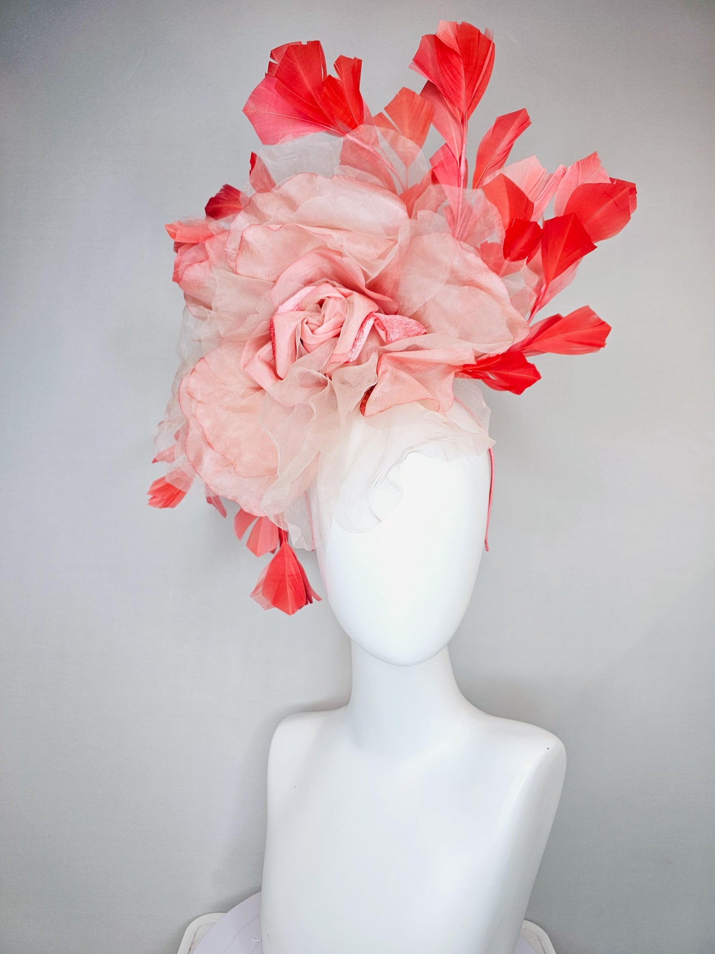 kentucky derby hat fascinator with large ombre peach pink organza flower and coral orange feathers, thin headband