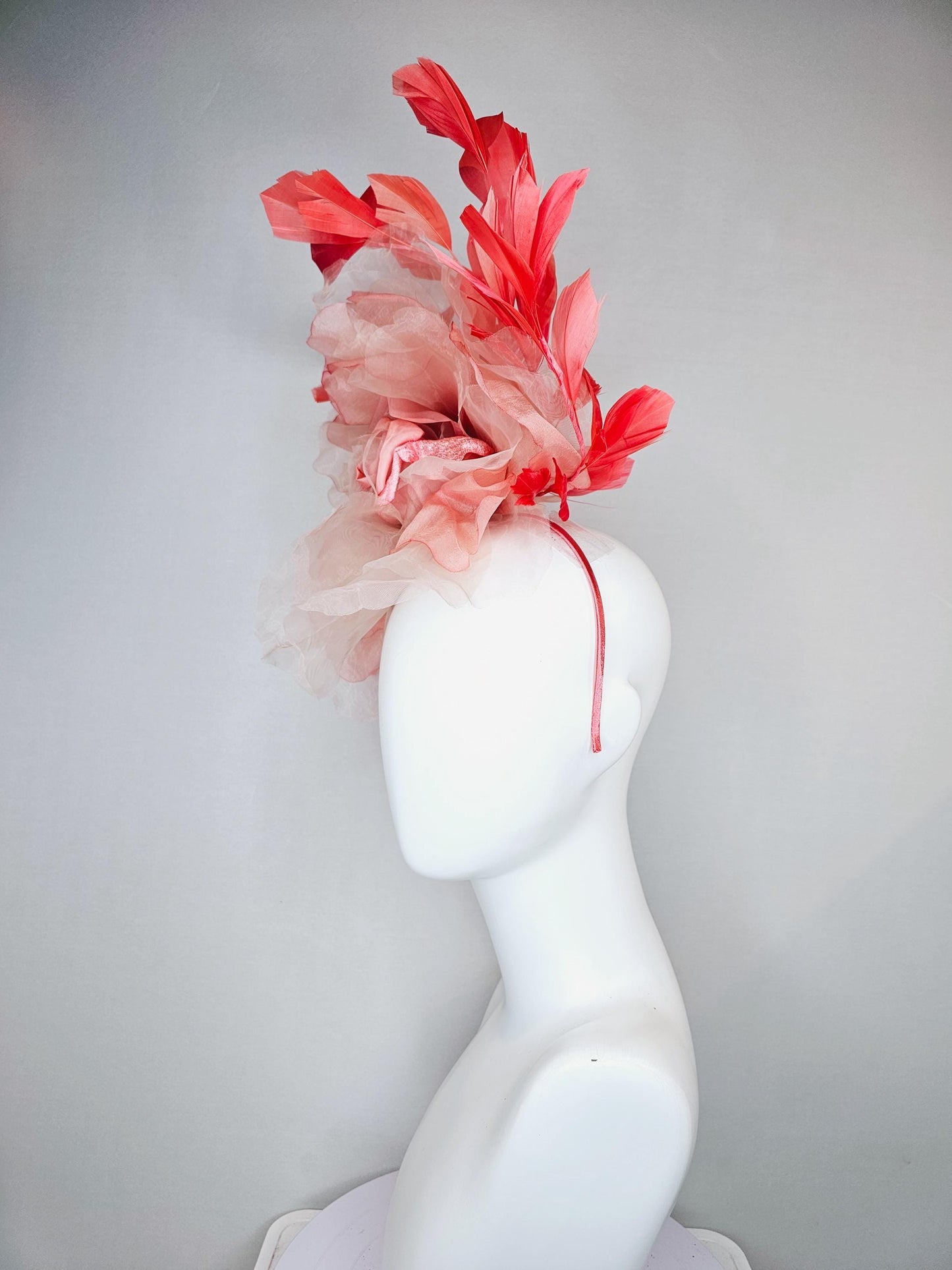 kentucky derby hat fascinator with large ombre peach pink organza flower and coral orange feathers, thin headband