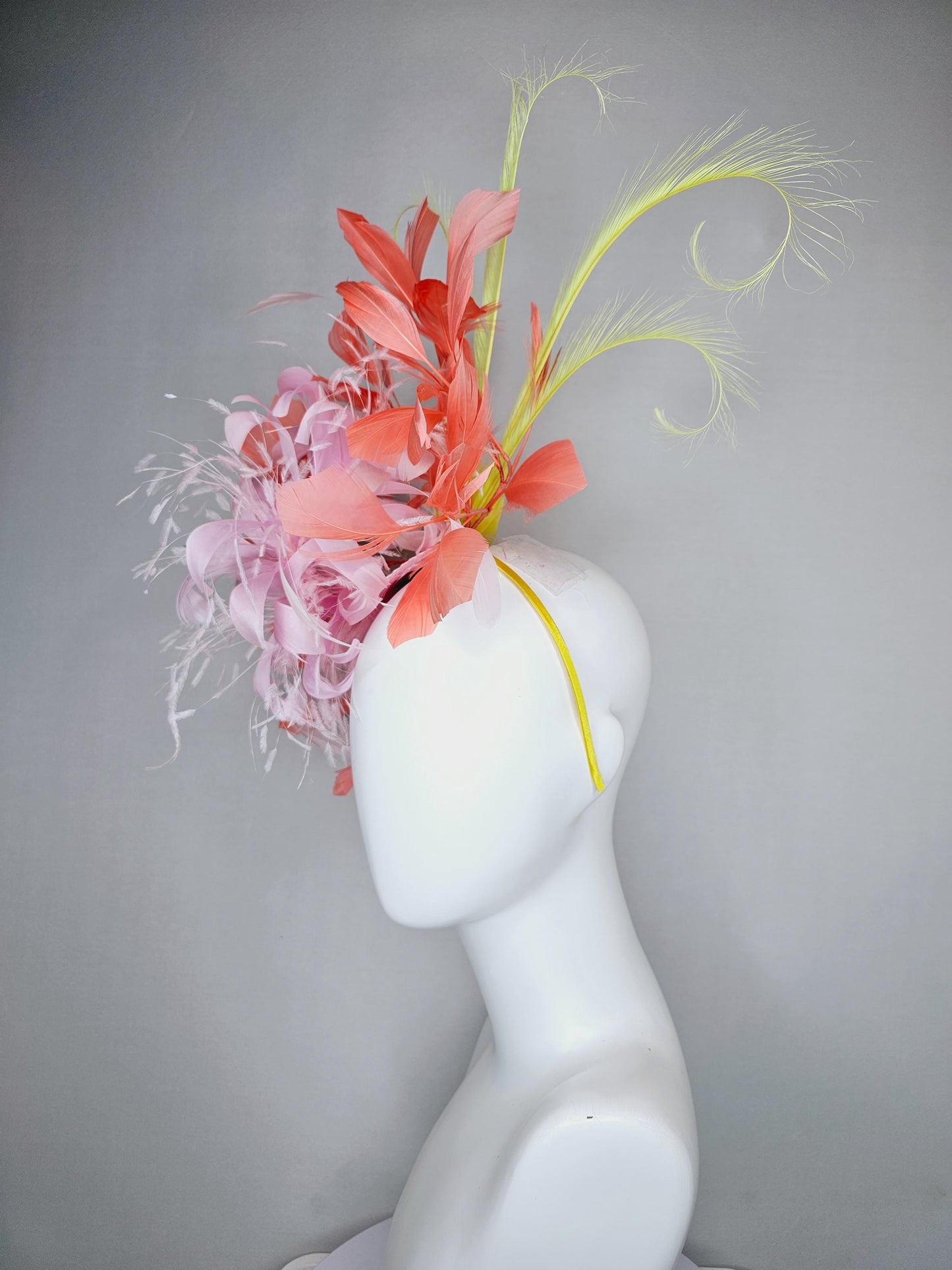 kentucky derby hat fascinator light pink fluffy feather flowers with coral orange feathers, yellow feathers, thin headband