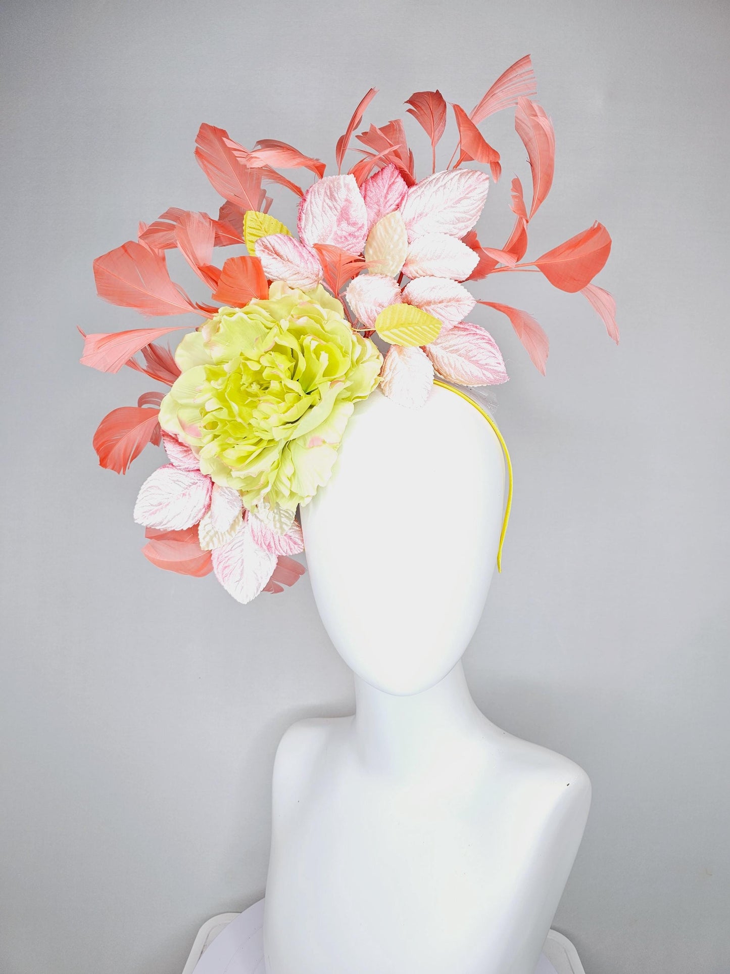 kentucky derby hat fascinator with yellow satin silk flower and light blush pink leaves, orange coral feathers on thin headband