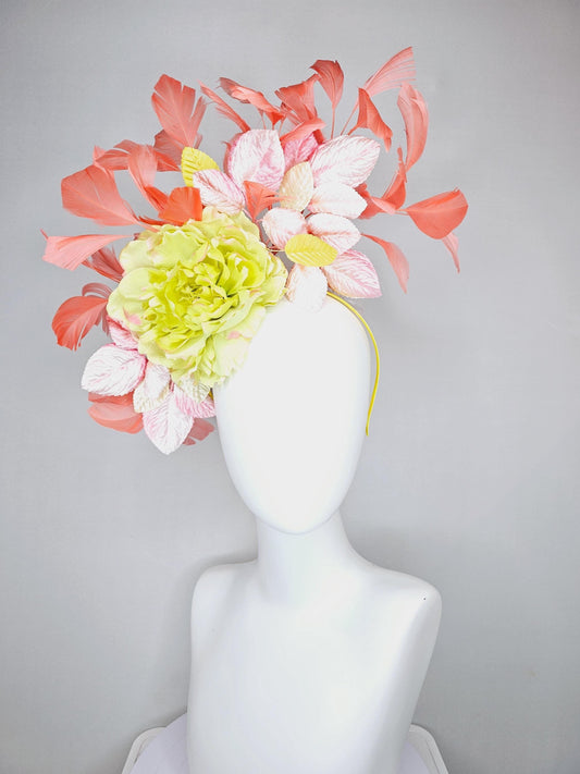 kentucky derby hat fascinator with yellow satin silk flower and light blush pink leaves, orange coral feathers on thin headband