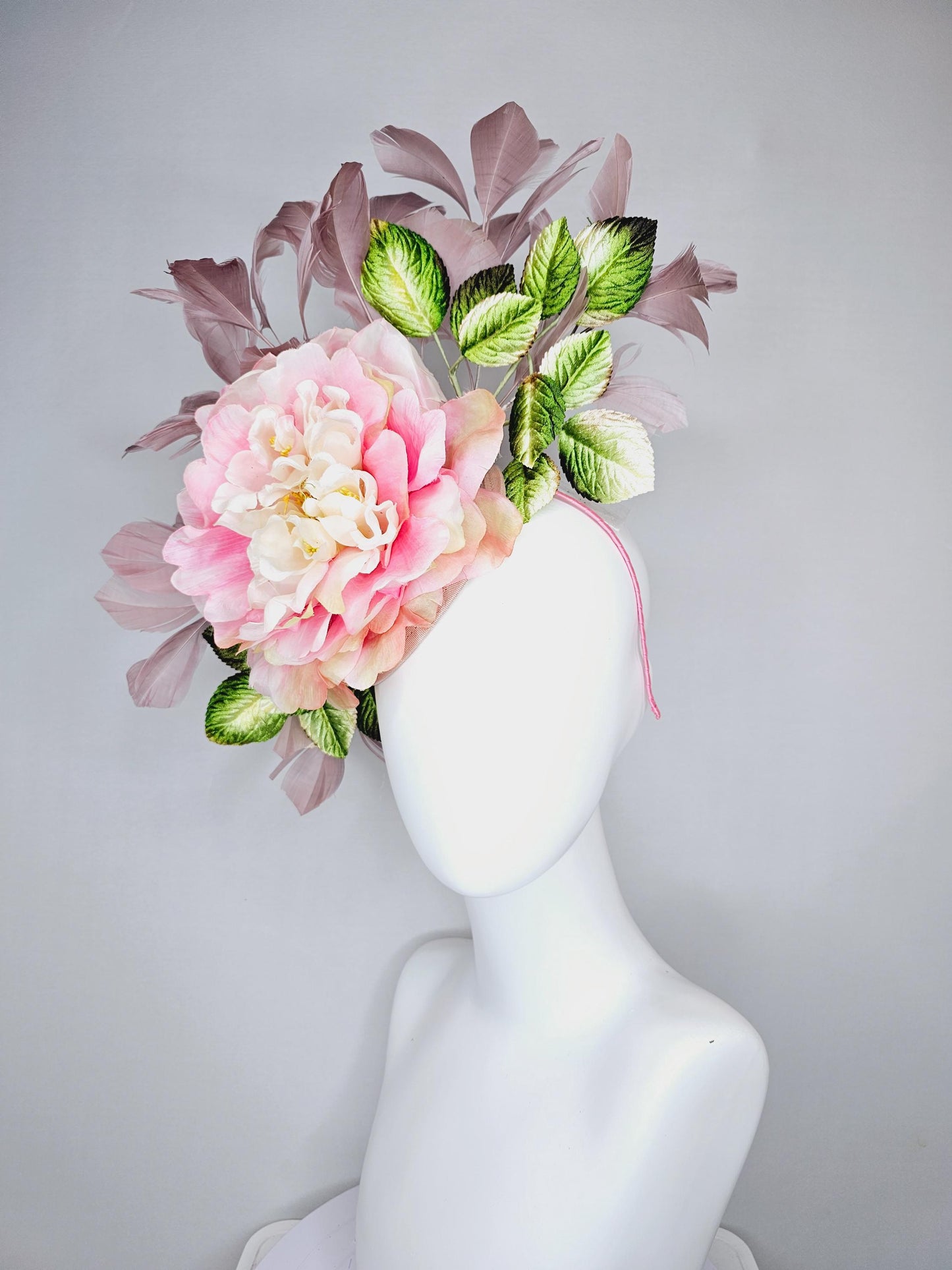 kentucky derby hat fascinator with large blush pink ombre satin silk flower with green ombre leaves and taupe feathers, thin headband