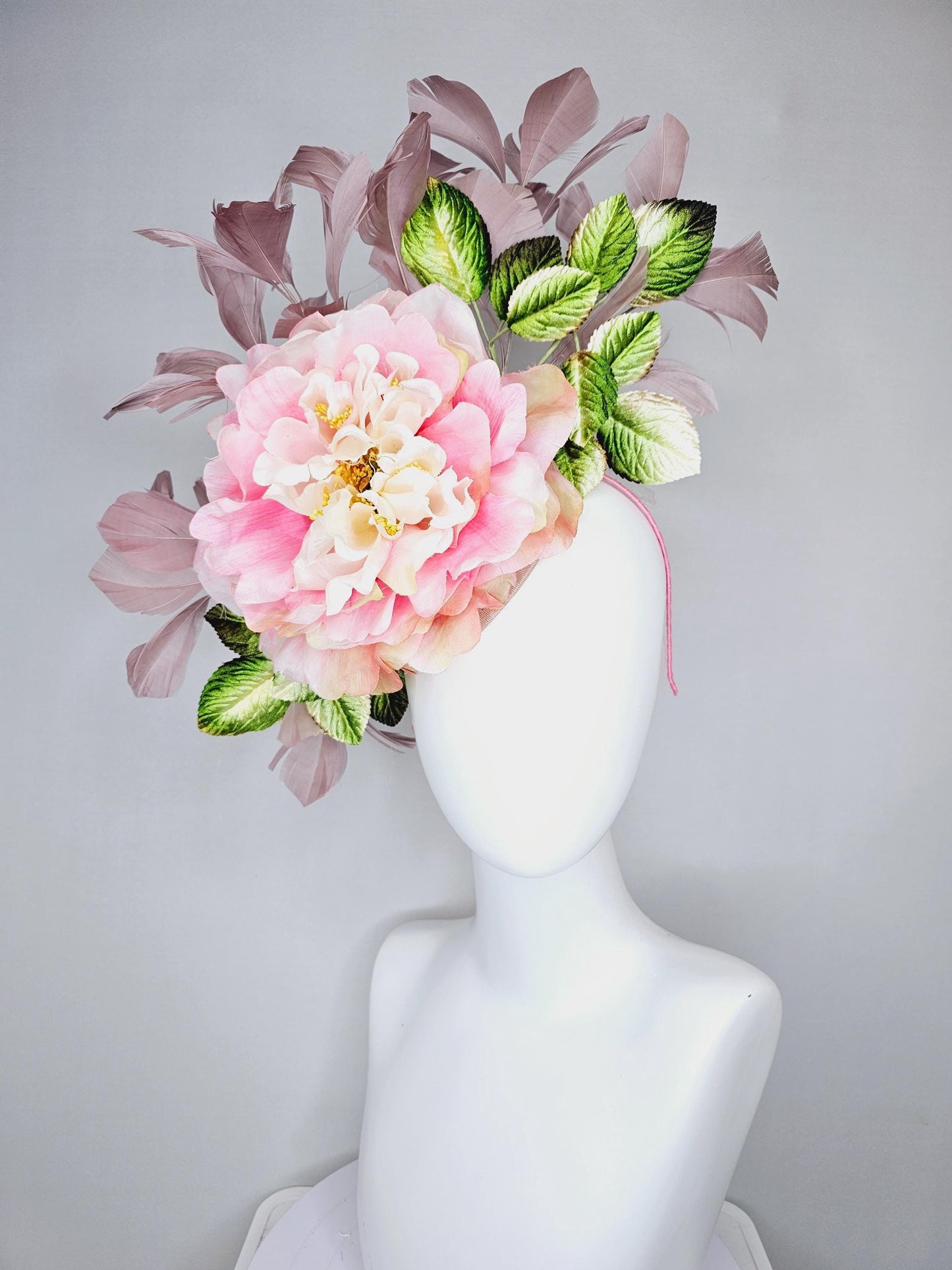 kentucky derby hat fascinator with large blush pink ombre satin silk flower with green ombre leaves and taupe feathers, thin headband