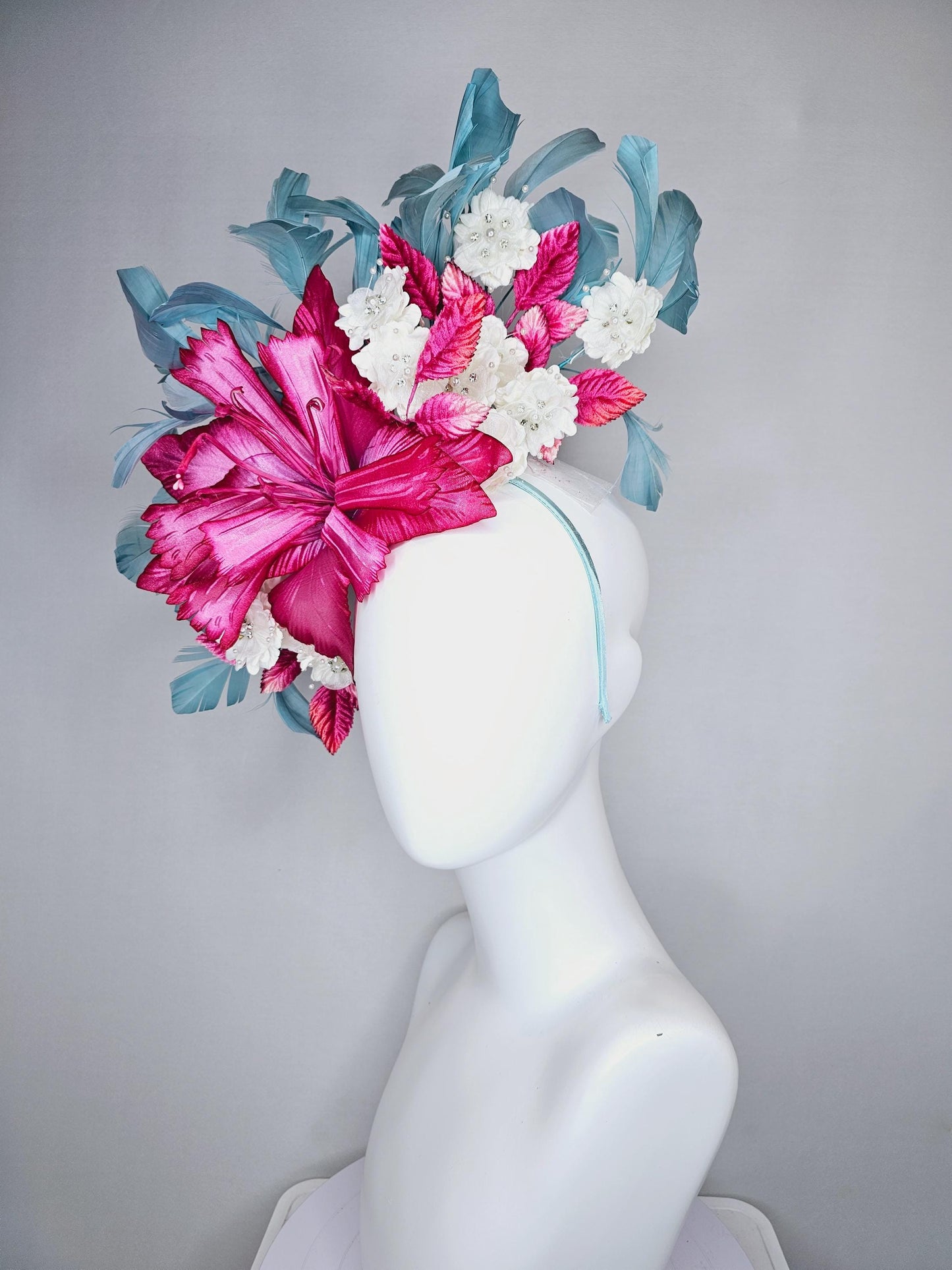 kentucky derby hat fascinator black sinamay,pink fuchsia satin flower,small white flowers with crystal pearl,pink leaves,teal blue feathers