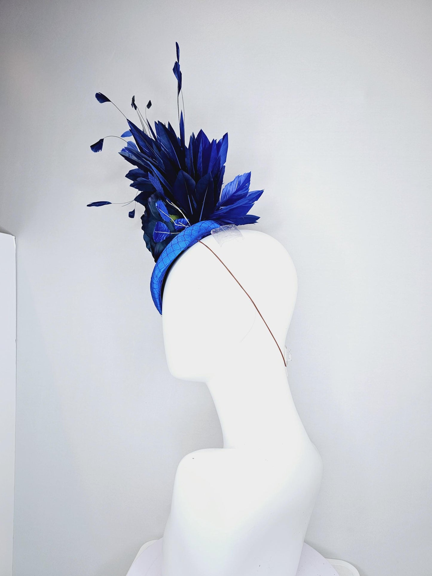 kentucky derby hat fascinator royal blue satin with netting,navy blue rose flower,cobalt blue leaves,navy royal blue branching feathers