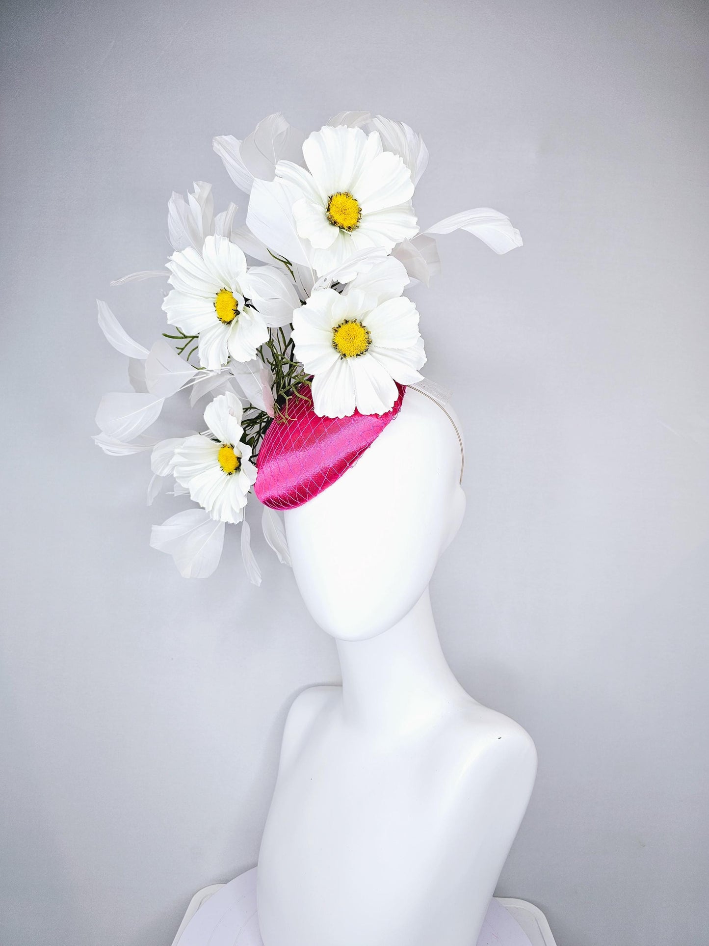 kentucky derby hat fascinator pink fuchsia satin with netting, white satin flowers with yellow center, green stems, white ivory feathers