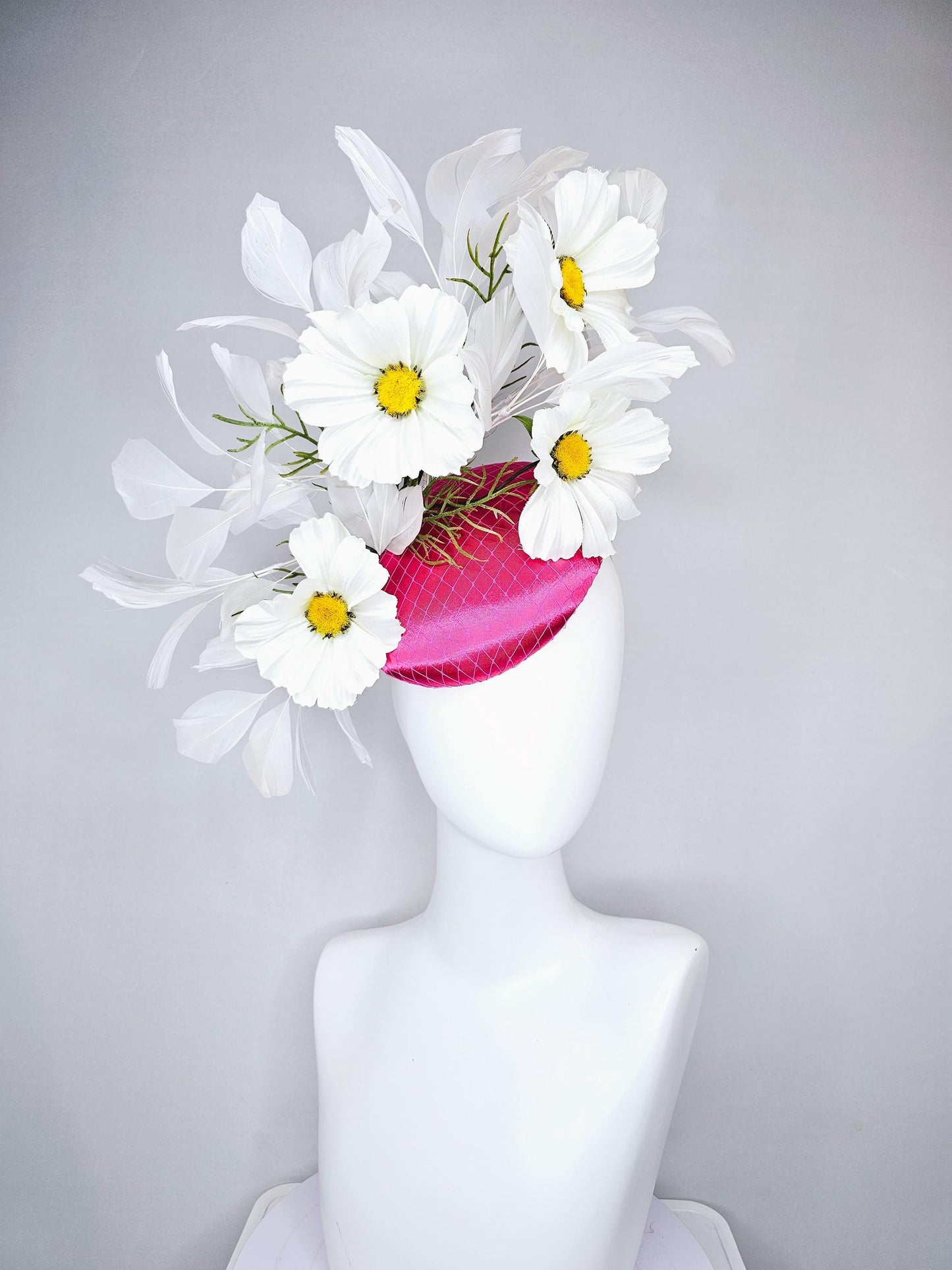 kentucky derby hat fascinator pink fuchsia satin with netting, white satin flowers with yellow center, green stems, white ivory feathers