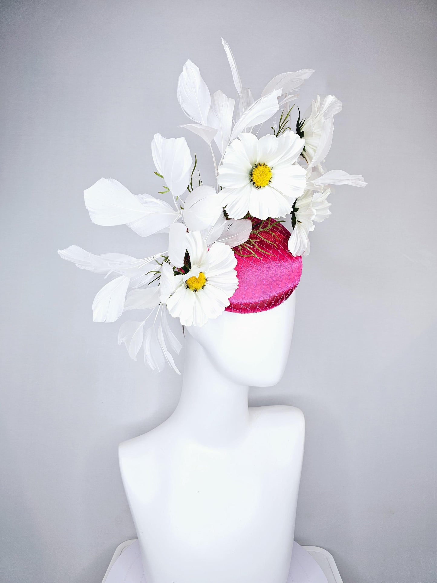 kentucky derby hat fascinator pink fuchsia satin with netting, white satin flowers with yellow center, green stems, white ivory feathers