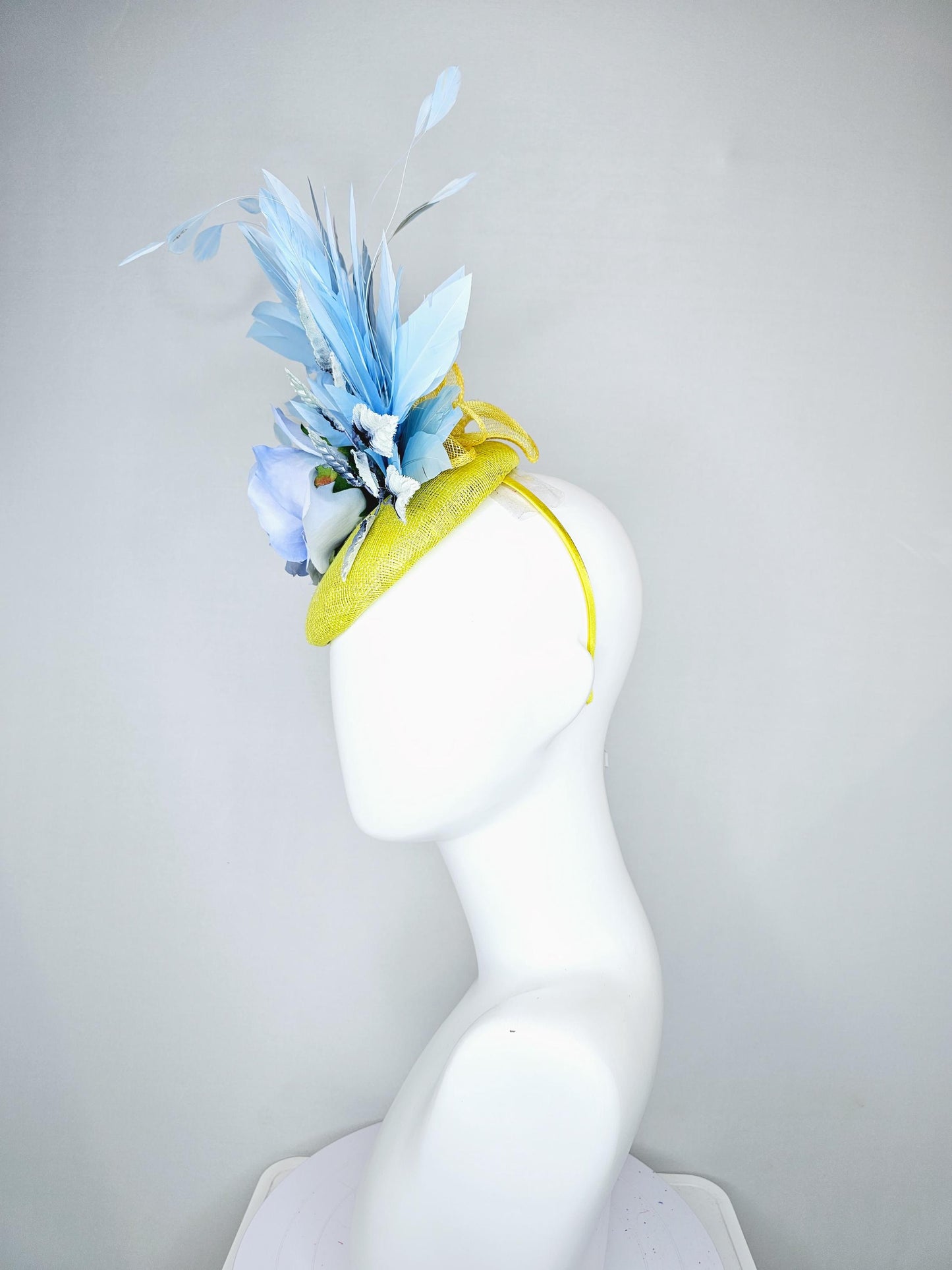 kentucky derby hat fascinator yellow sinamay, light baby blue satin rose flower, ombre navy blue leaves, sky blue branching feathers