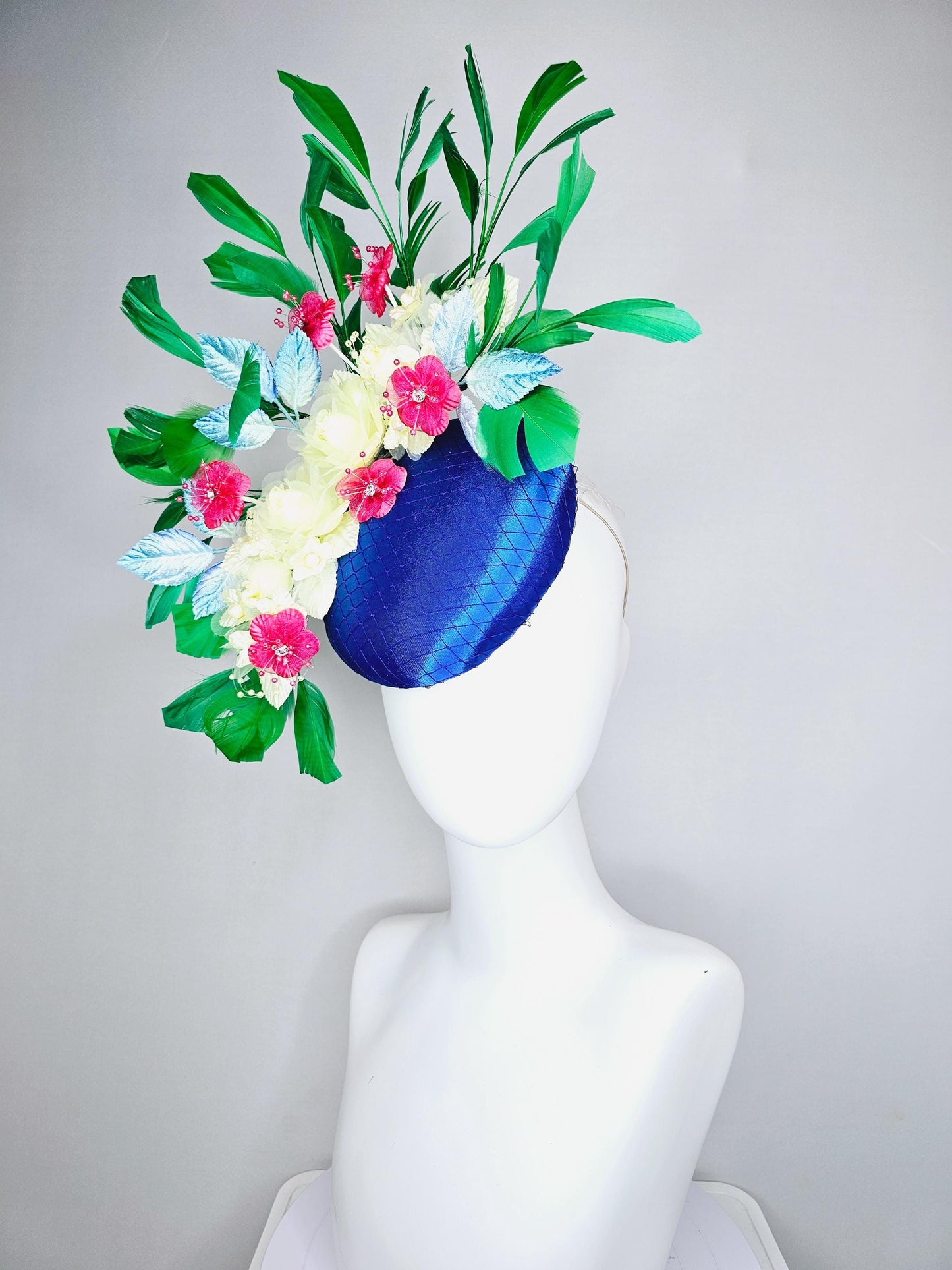 kentucky derby hat fascinator royal blue satin w/ netting, light yellow pink organza satin flowers, ombre blue leaves,emerald green feathers