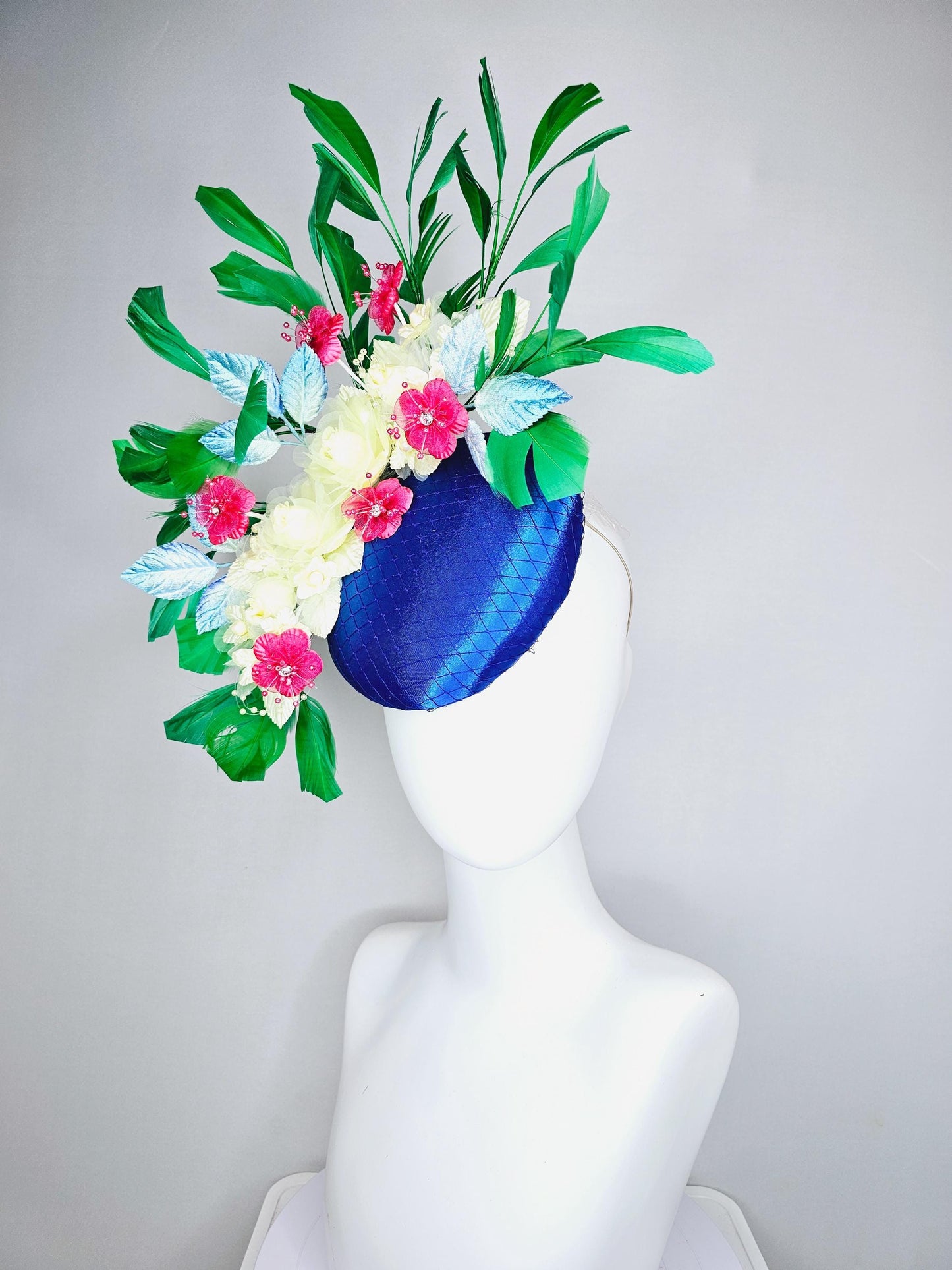 kentucky derby hat fascinator royal blue satin w/ netting, light yellow pink organza satin flowers, ombre blue leaves,emerald green feathers