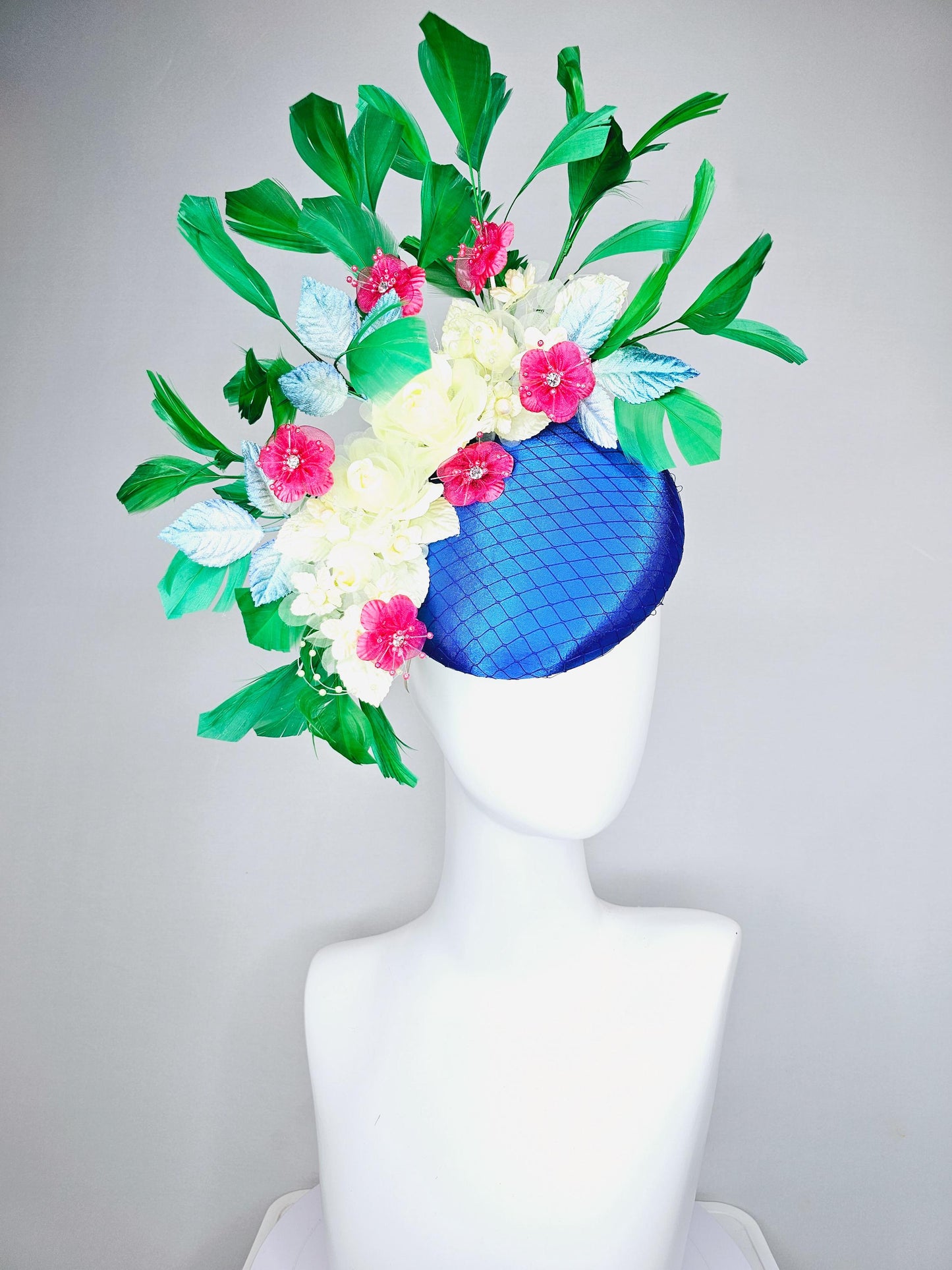 kentucky derby hat fascinator royal blue satin w/ netting, light yellow pink organza satin flowers, ombre blue leaves,emerald green feathers