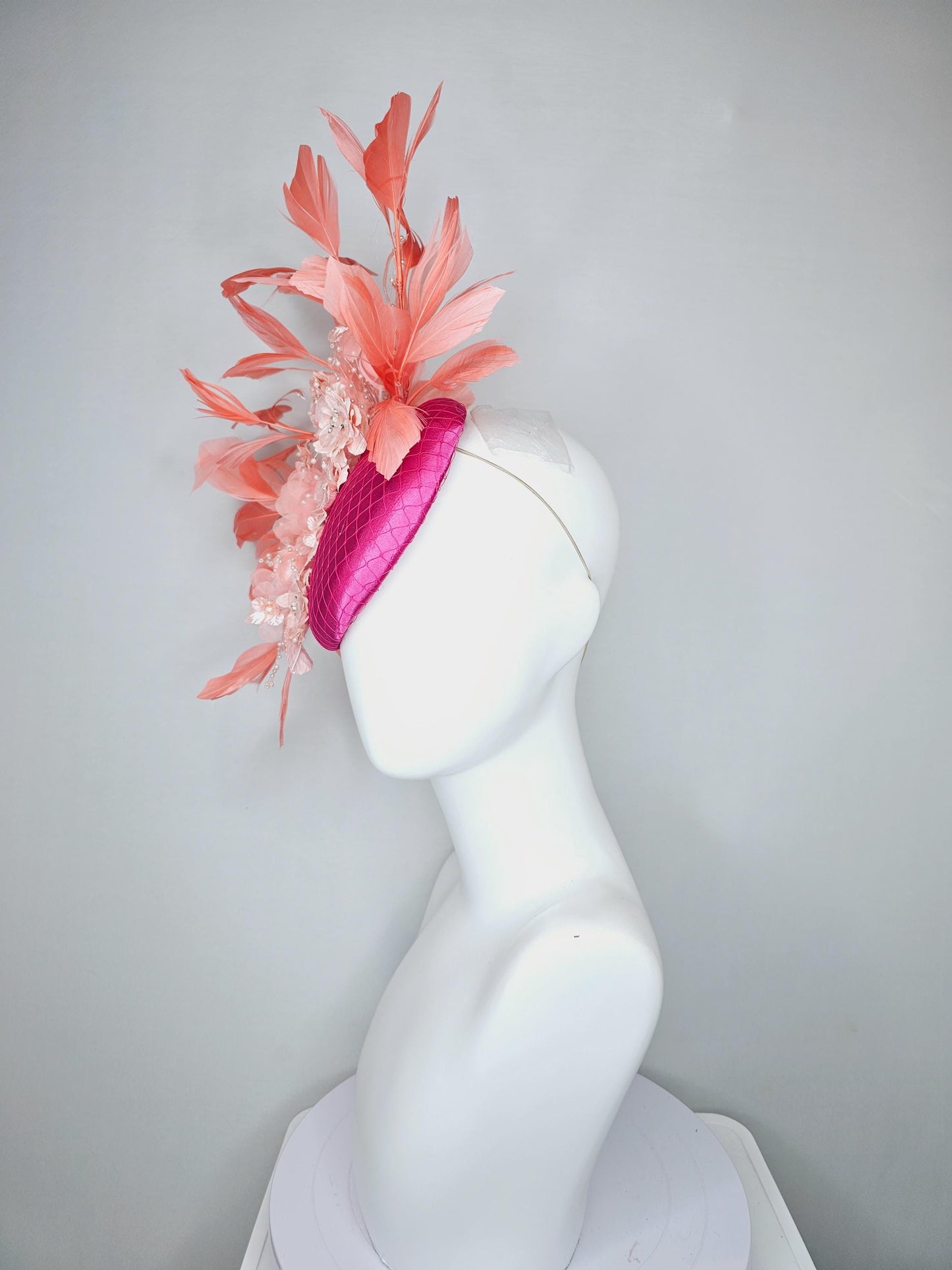 kentucky derby hat fascinator bright pink satin with netting, light blush pink organza satin flowers,light pink leaves,coral orange feathers