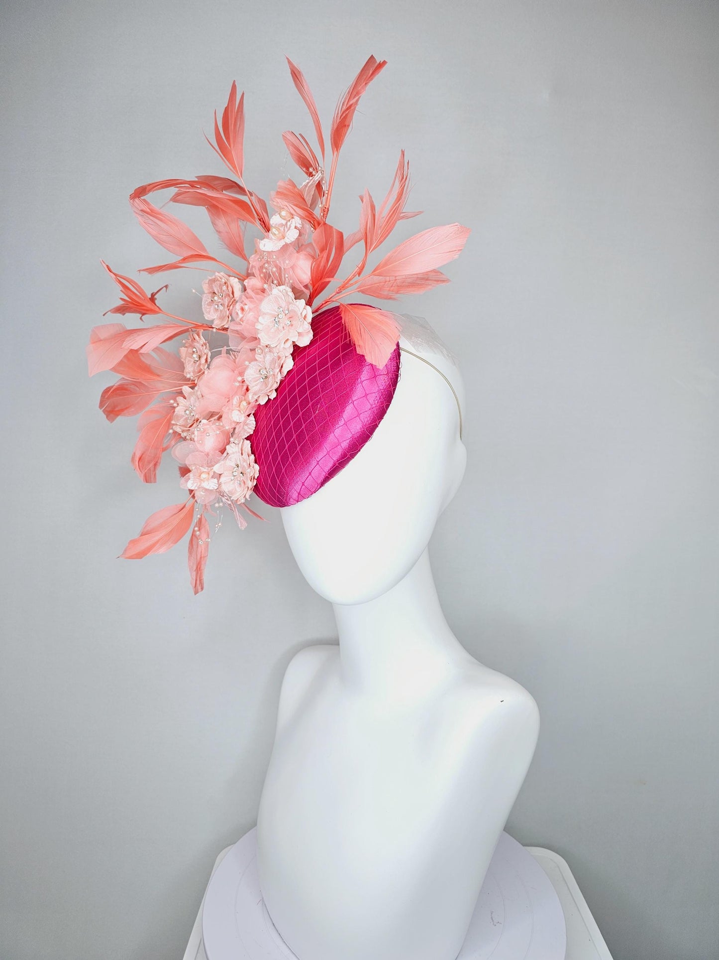 kentucky derby hat fascinator bright pink satin with netting, light blush pink organza satin flowers,light pink leaves,coral orange feathers