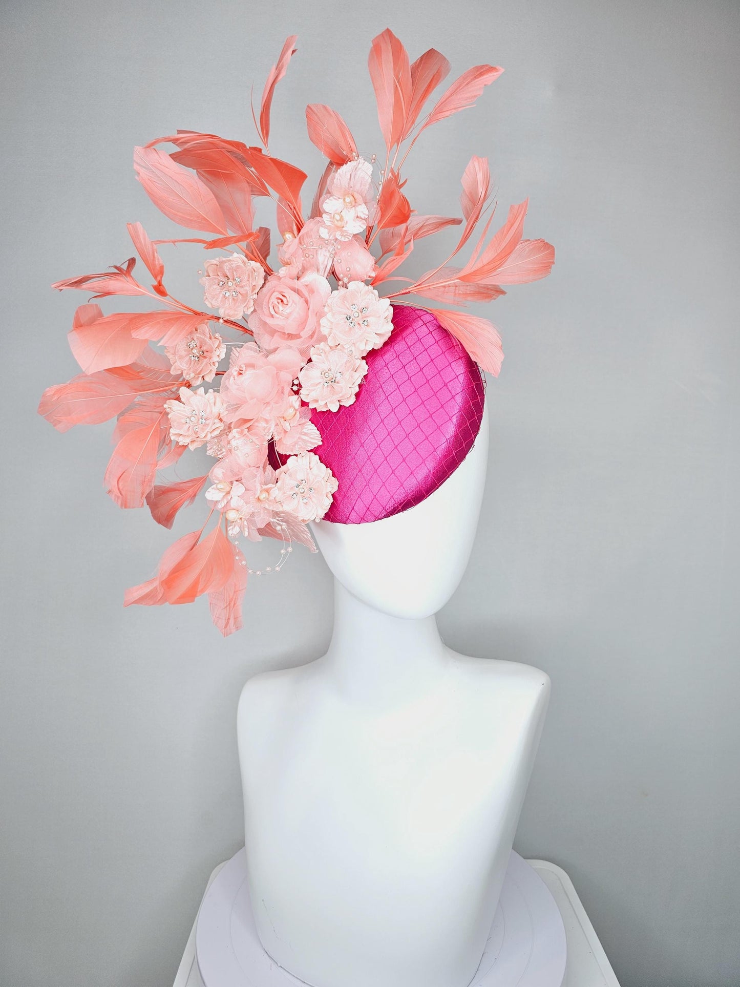 kentucky derby hat fascinator bright pink satin with netting, light blush pink organza satin flowers,light pink leaves,coral orange feathers