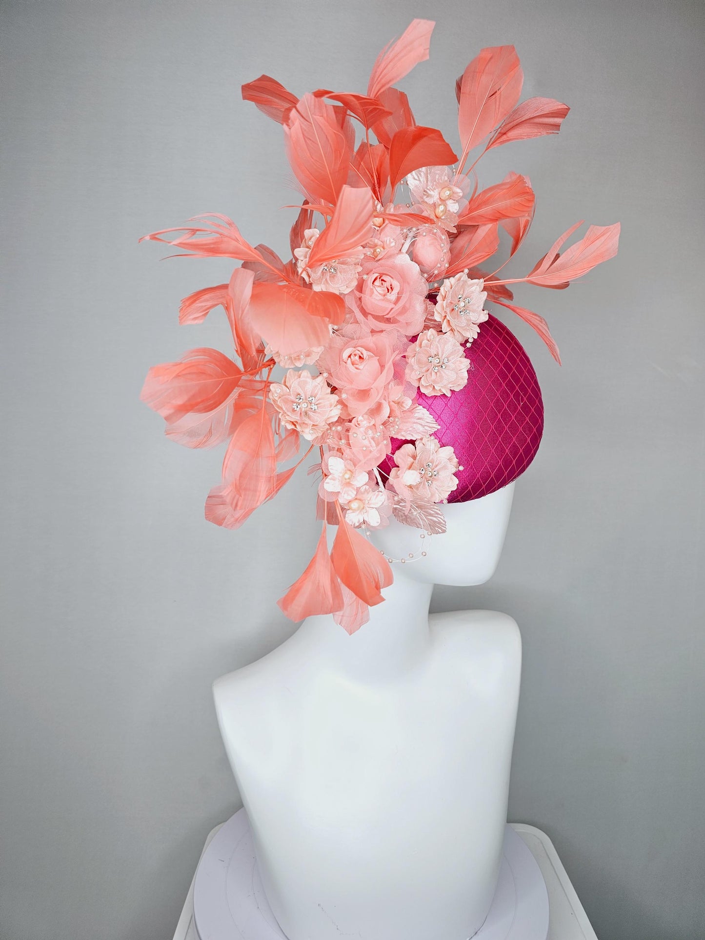 kentucky derby hat fascinator bright pink satin with netting, light blush pink organza satin flowers,light pink leaves,coral orange feathers