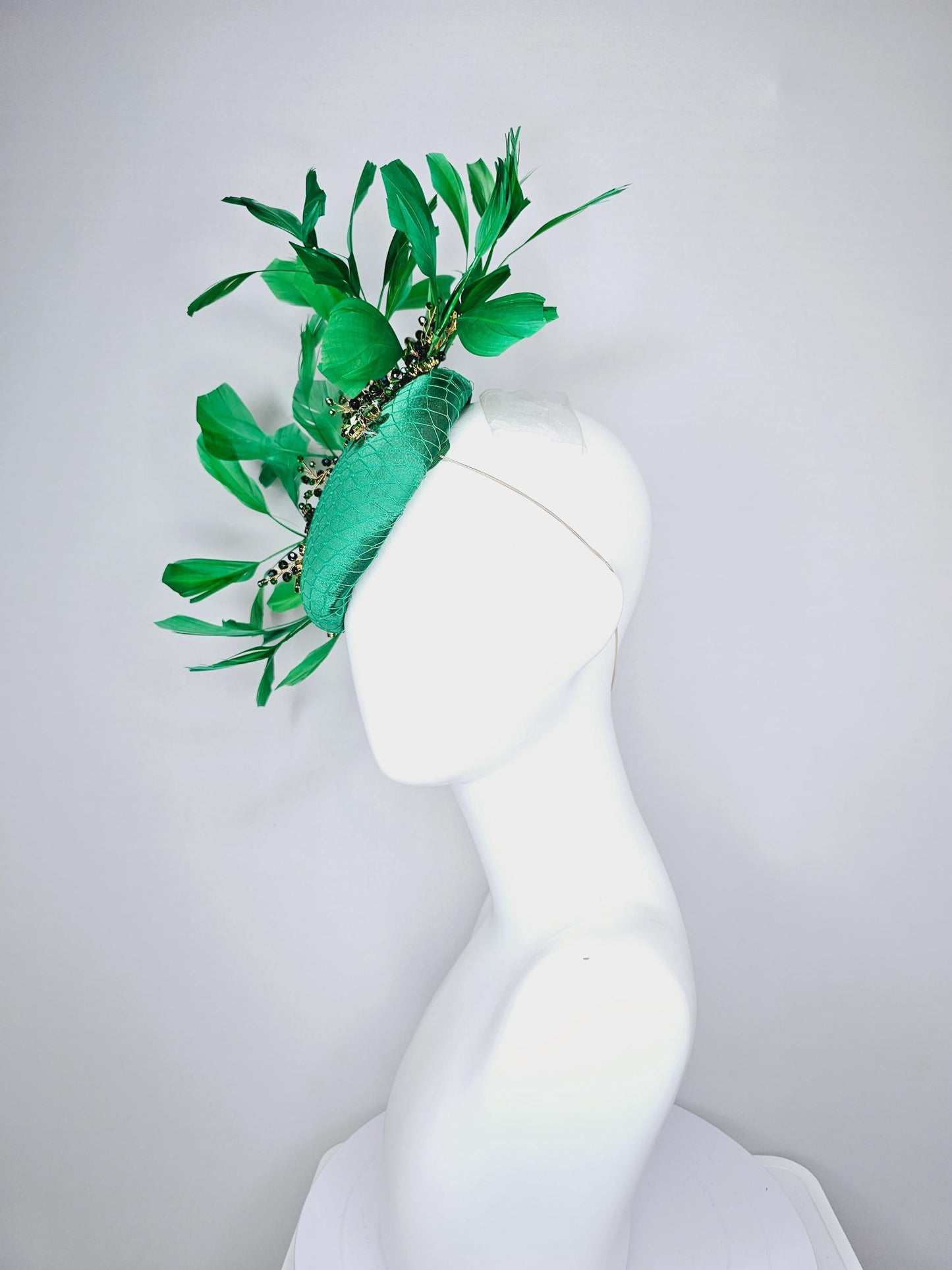 kentucky derby hat fascinator emerald green satin with netting and green crystal beaded jewels stems, emerald green branching feathers