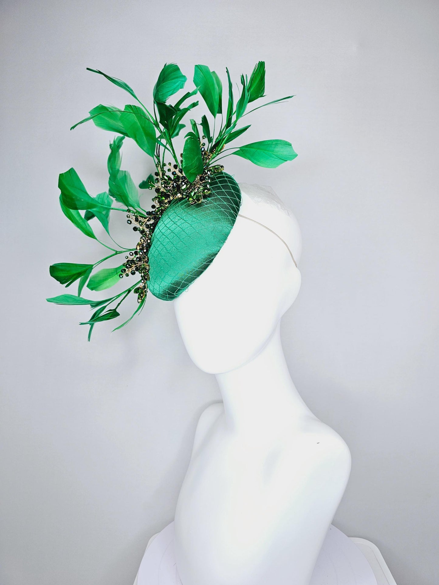 kentucky derby hat fascinator emerald green satin with netting and green crystal beaded jewels stems, emerald green branching feathers