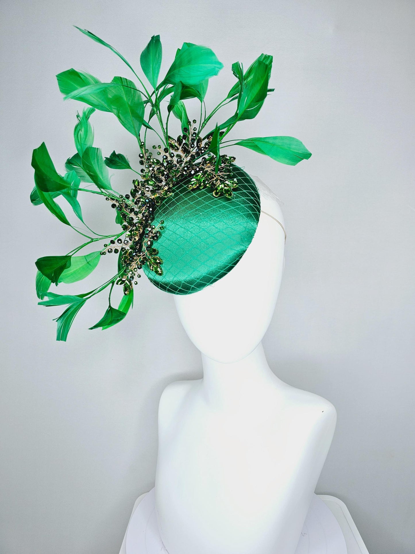 kentucky derby hat fascinator emerald green satin with netting and green crystal beaded jewels stems, emerald green branching feathers