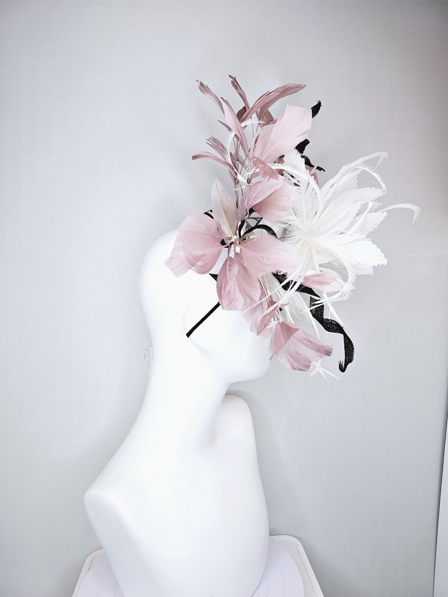 kentucky derby hat fascinator black sinamay with curls and beige neutral blush pink branching feathers with large white feather flower