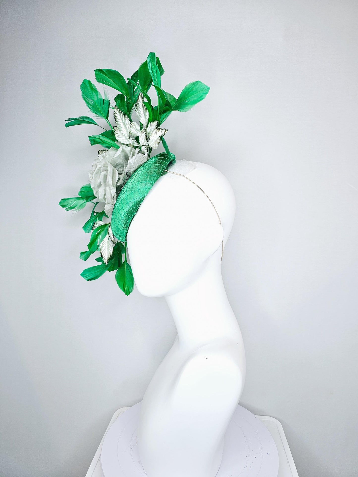 kentucky derby hat fascinator with emerald green satin with netting and mint light green satin silk rose flowers, green branching feathers