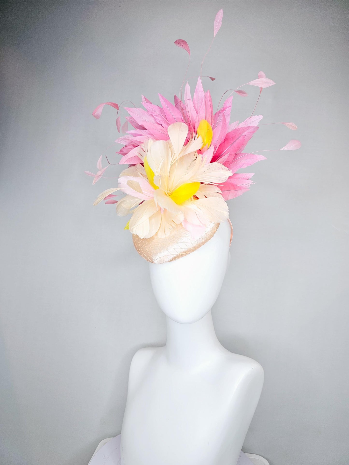 kentucky derby hat fascinator champagne satin with netting,cream neutral and yellow feathers,with light pink branching feathers