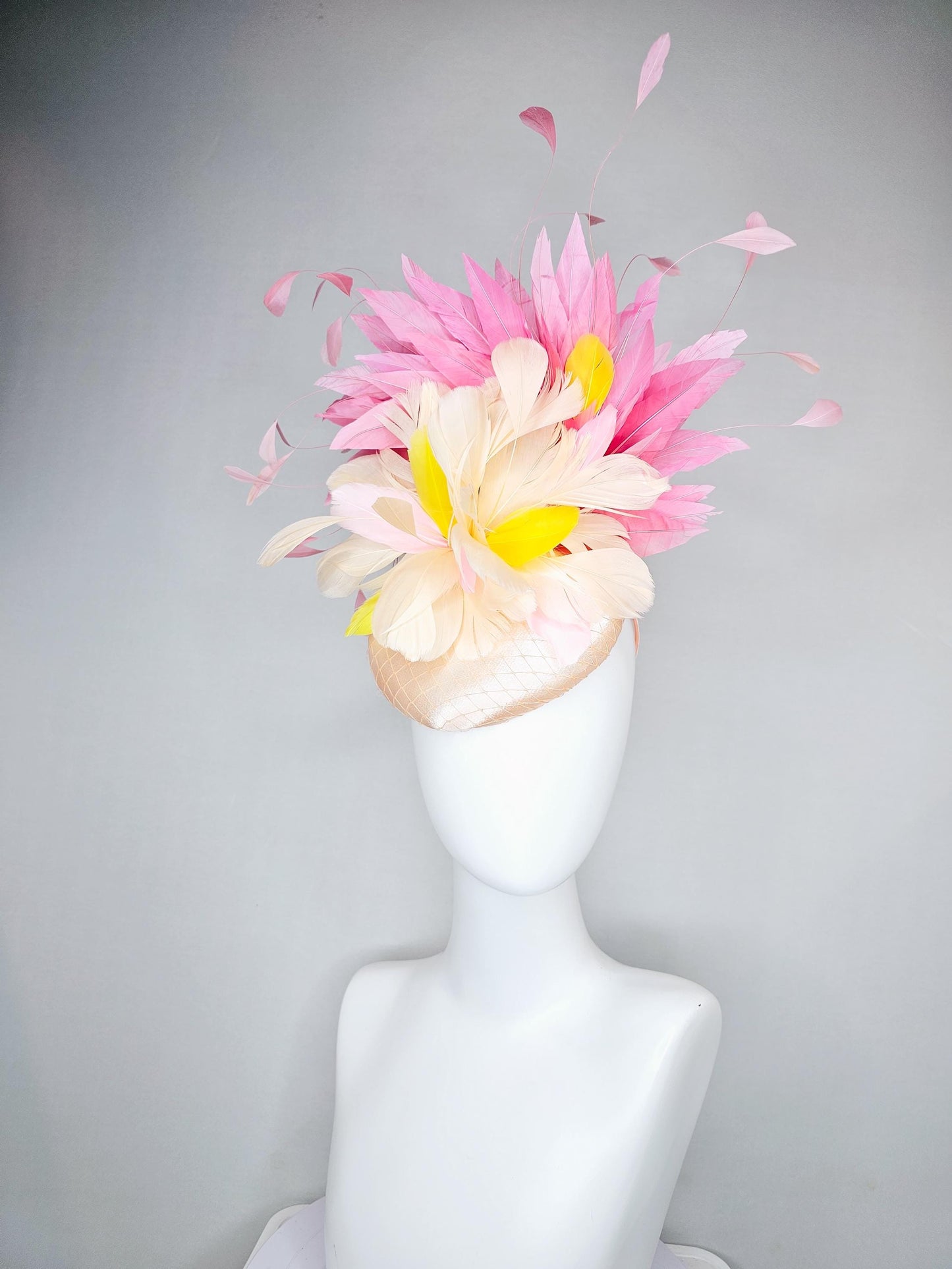 kentucky derby hat fascinator champagne satin with netting,cream neutral and yellow feathers,with light pink branching feathers