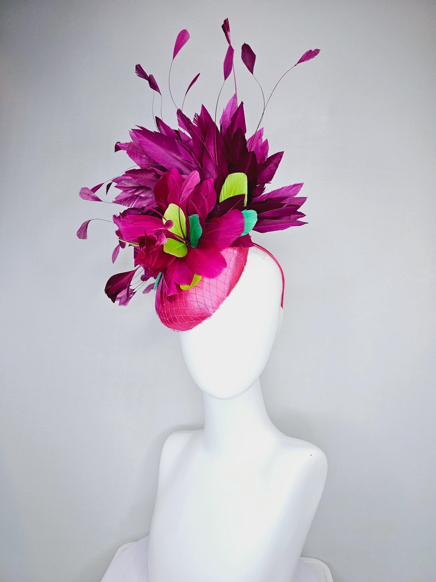 kentucky derby hat fascinator hot pink satin with netting,magenta purple branching feathers and lime green,blue green aqua,pink feathers