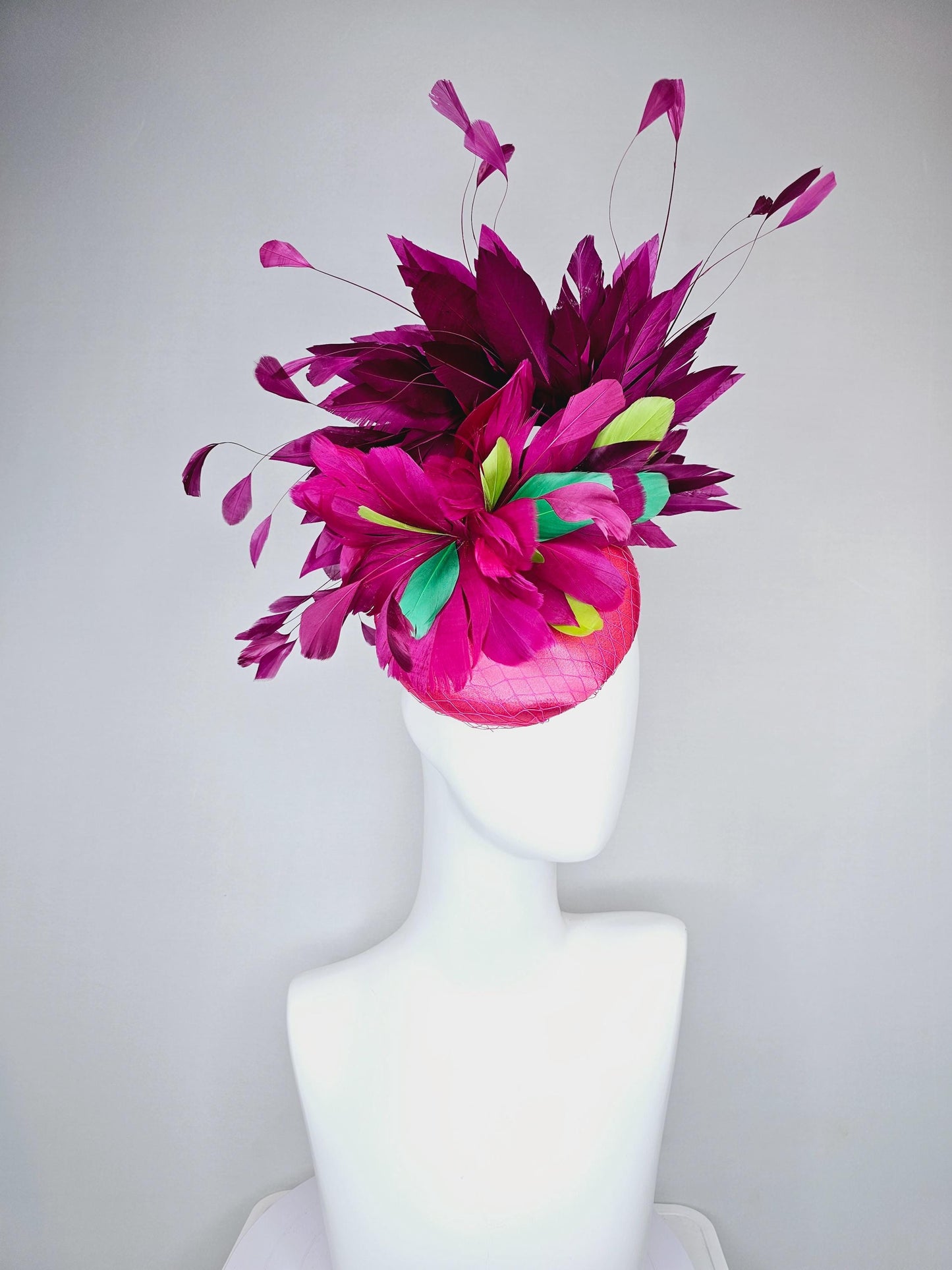 kentucky derby hat fascinator hot pink satin with netting,magenta purple branching feathers and lime green,blue green aqua,pink feathers