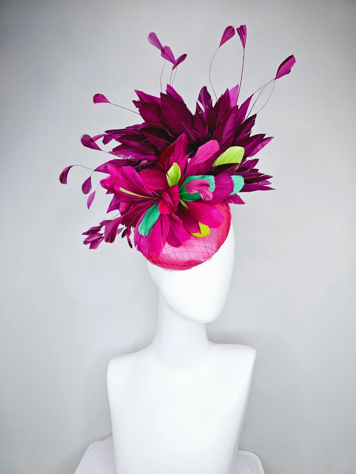 kentucky derby hat fascinator hot pink satin with netting,magenta purple branching feathers and lime green,blue green aqua,pink feathers