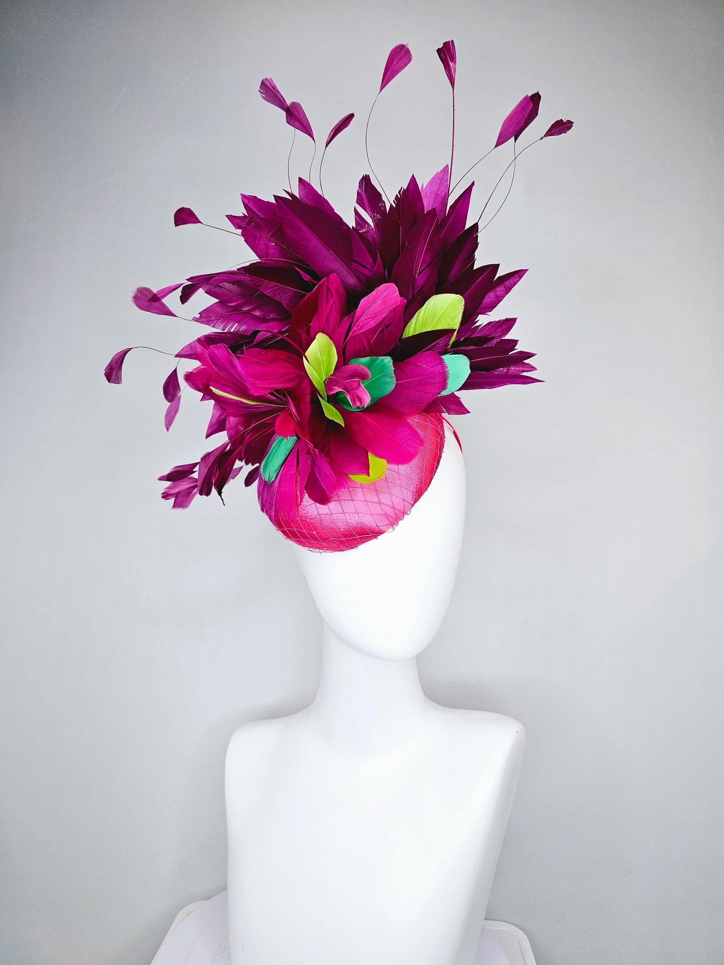 kentucky derby hat fascinator hot pink satin with netting,magenta purple branching feathers and lime green,blue green aqua,pink feathers