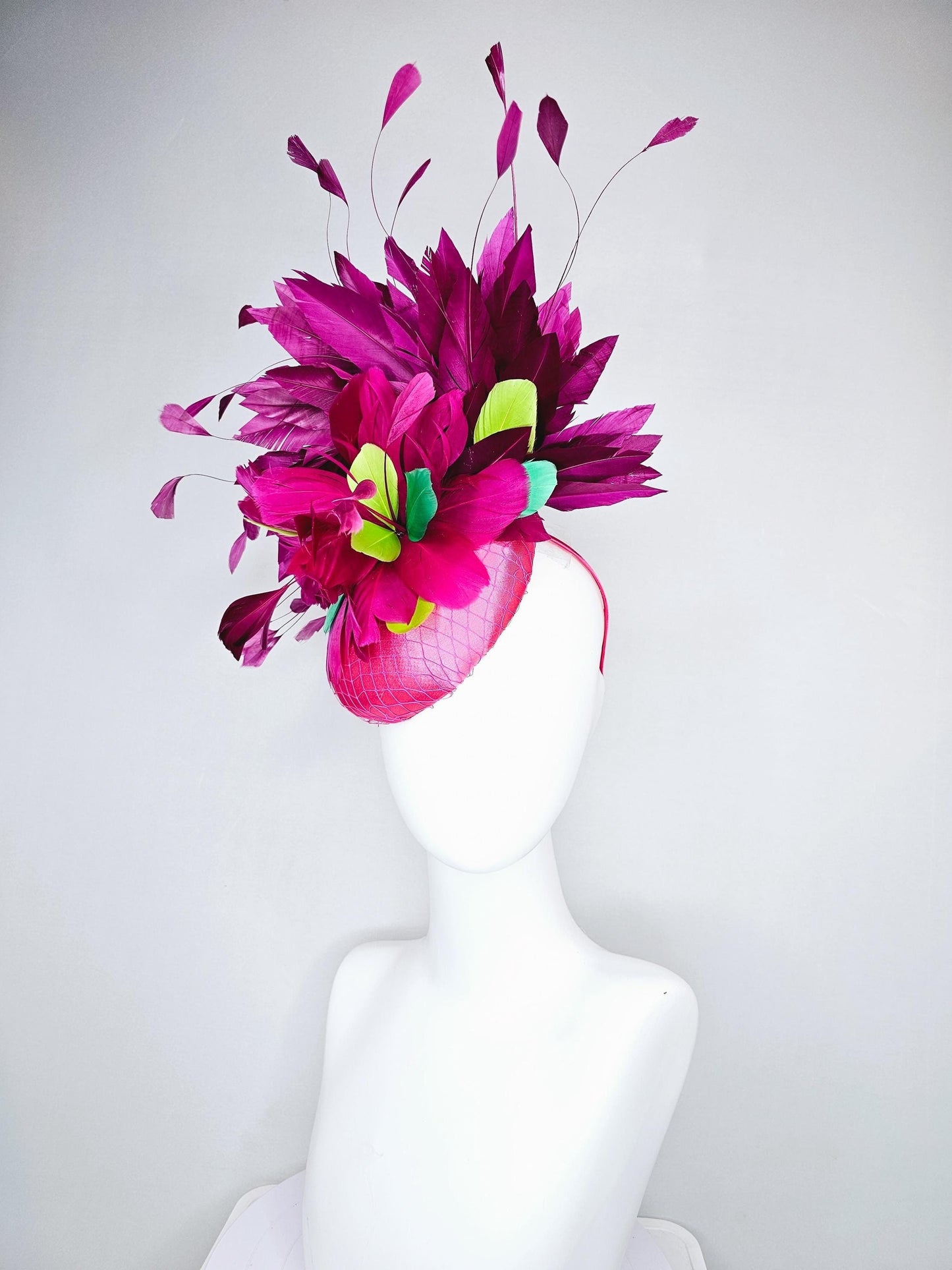 kentucky derby hat fascinator hot pink satin with netting,magenta purple branching feathers and lime green,blue green aqua,pink feathers