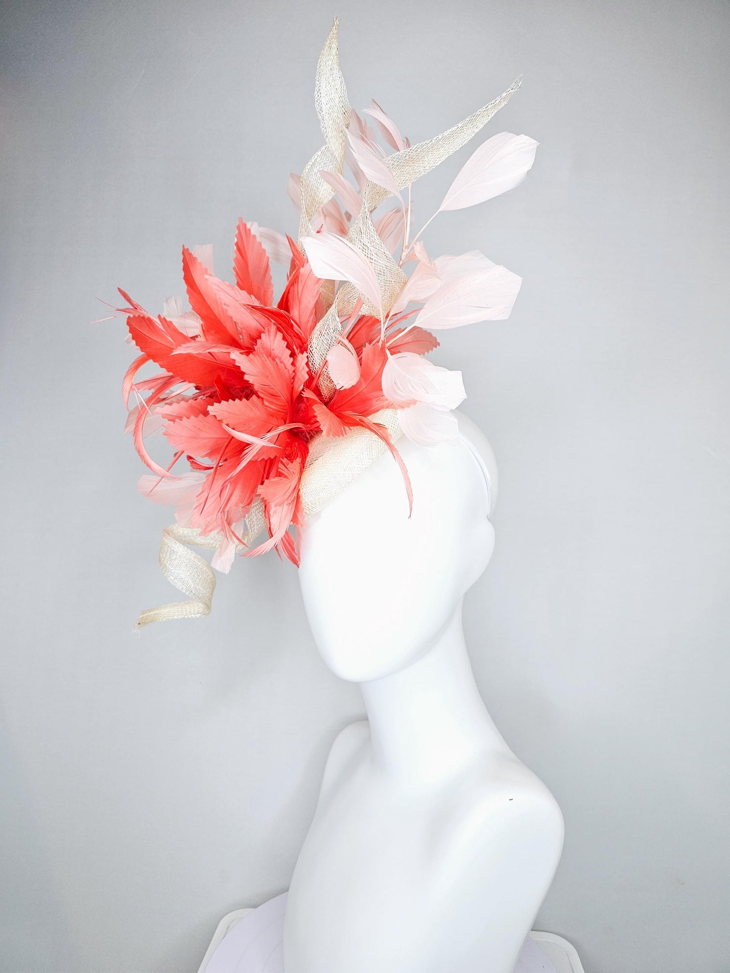 kentucky derby hat fascinator ivory white sinamay with curls,and coral feather flower with light pink branching feathers